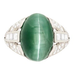 Late Art Deco 10.75 Carat Cat’s Eye Tourmaline and Diamond Ring, circa 1940s