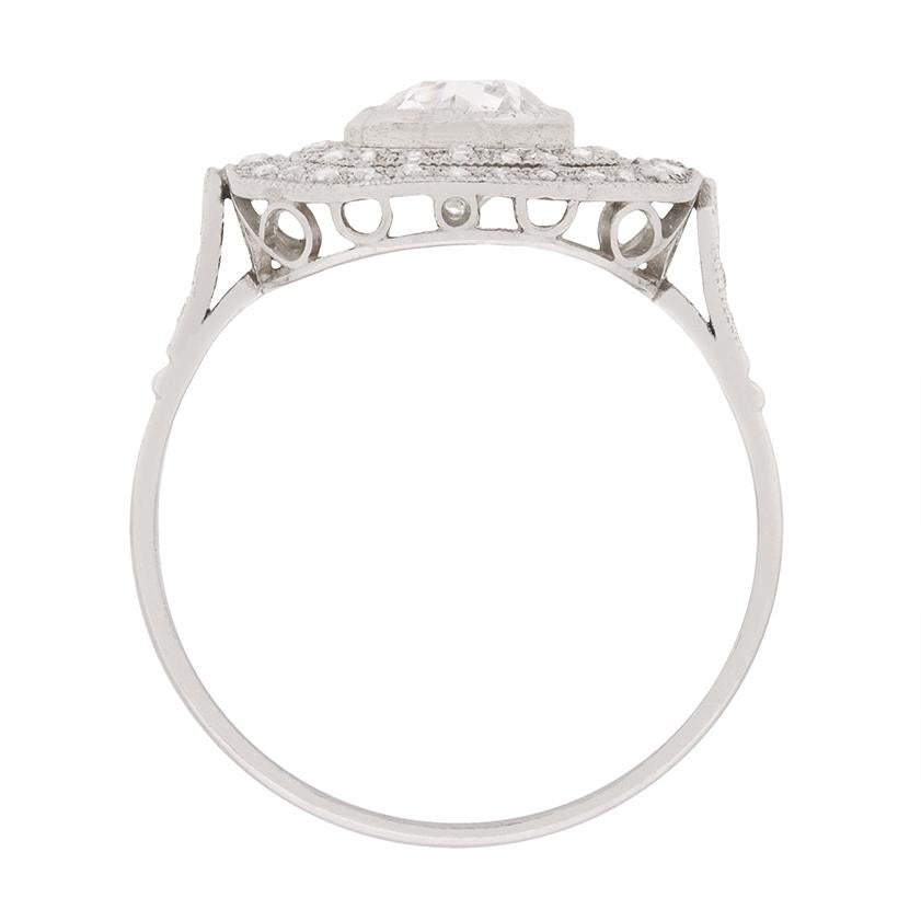 Dating from the latter Art Deco period, this striking c.1930s cluster ring presents an old cut diamond weighing one carat within a double octagonal halo consisting of 0.58 carats of grain set old cuts.

The ring’s antique platinum setting is