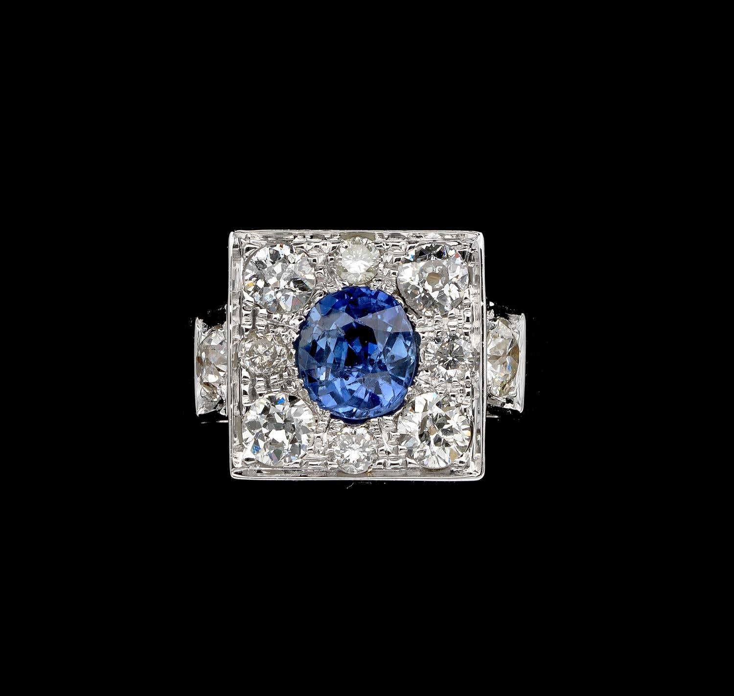 Stellar Sapphire!

This outstanding Diamond and Natural sapphire ring dates 1935 ca
Distinctive design of sleek style substantially hand created of solid 18 KT white gold, punched for gold and maker mark
The linear crown of imposing look raises up