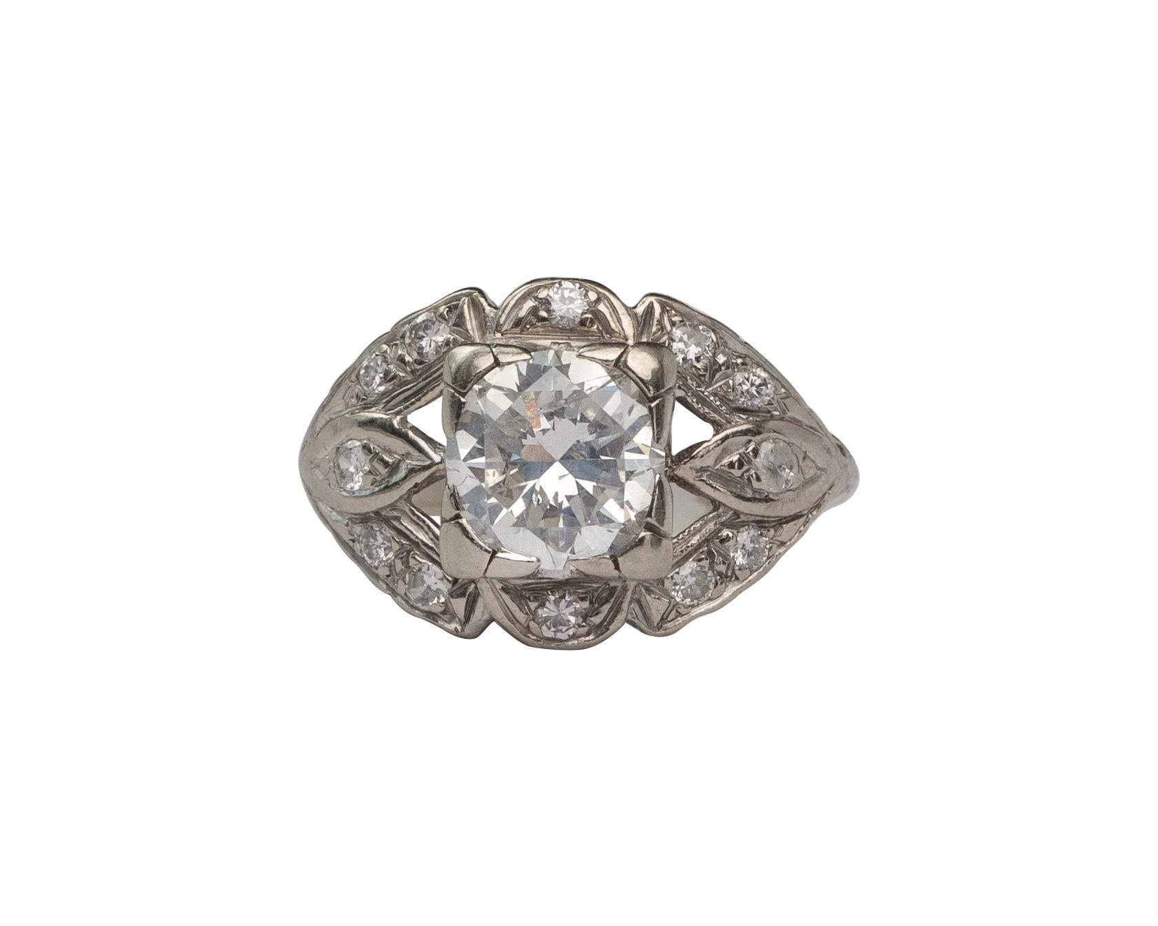 Here we have an beautiful example of an vintage era engagement ring! This genuine 1940's ring features a lovely 1.52 carat 