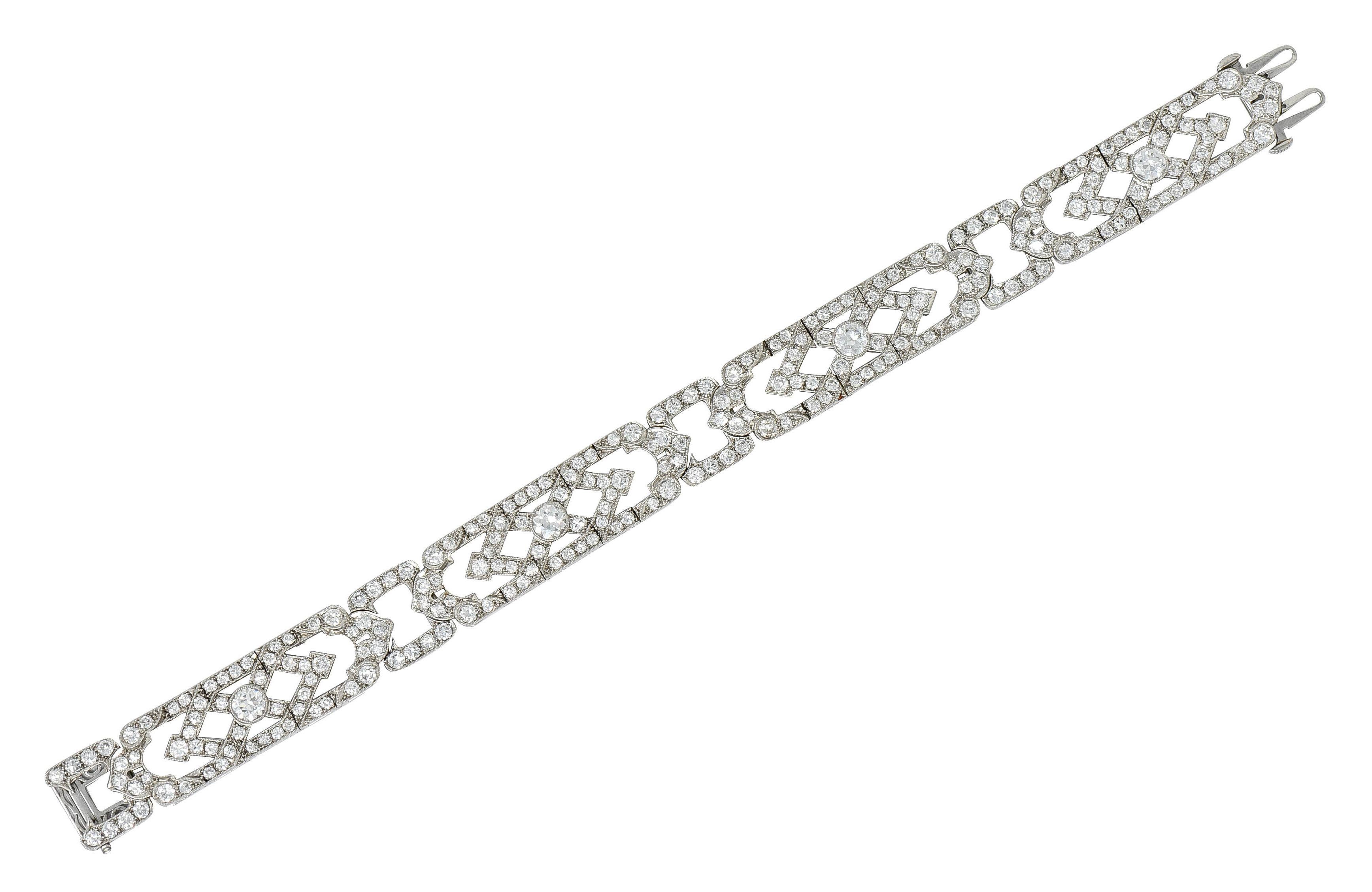 Wide line bracelet features a geometric and overlapping design that alternates with cushion shaped spacer links

With four bezel set transitional cut diamonds weighing in total approximately 1.55 carats - H to J color with VS clarity

Surrounded by