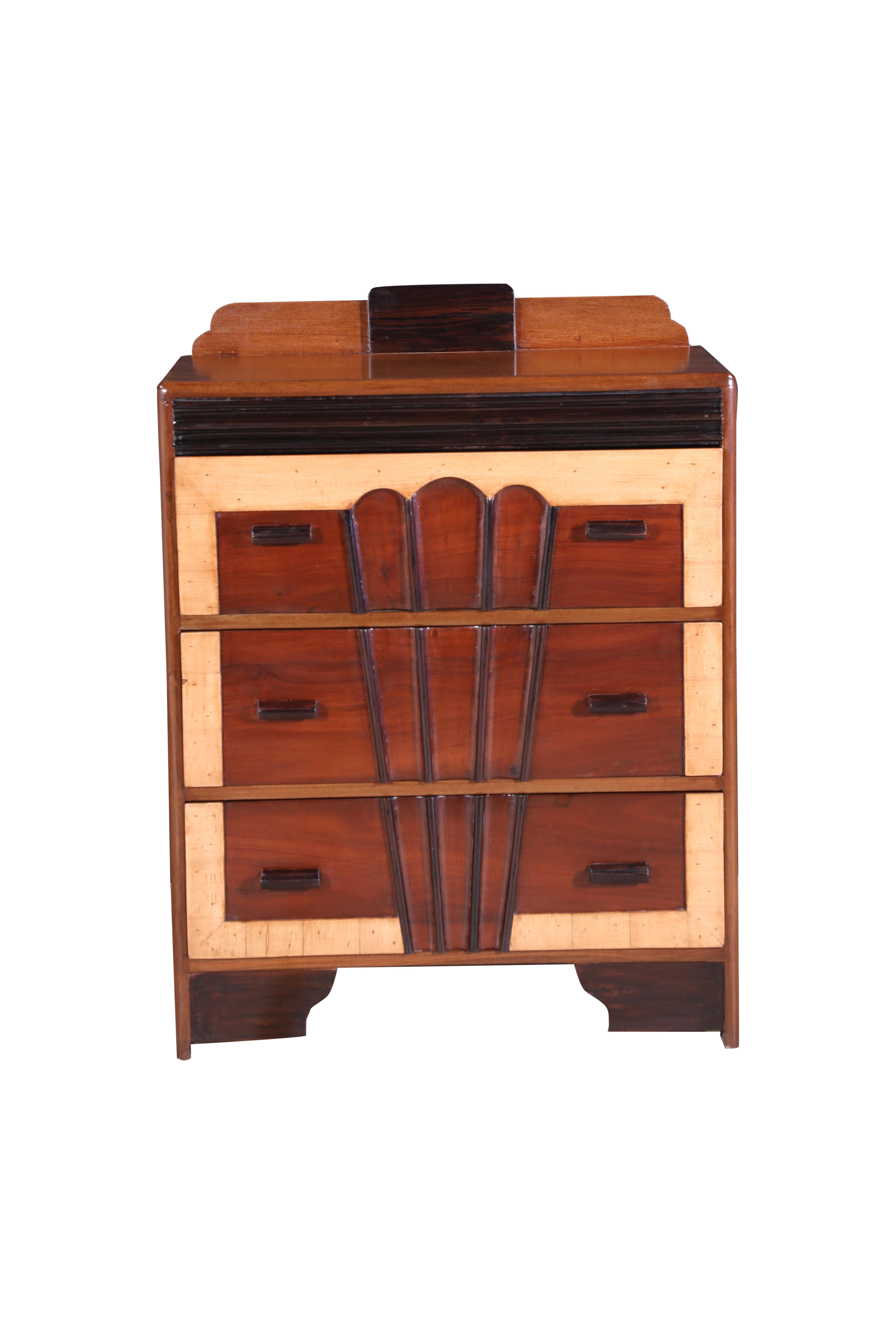 A late Art Deco Chest of Drawers or Dresser.  The body is predominantly teak wood with a satinwood border and additional detailing in rosewood including the drawer pulls.  All exotic hardwoods which made this piece easy to bring back to life through