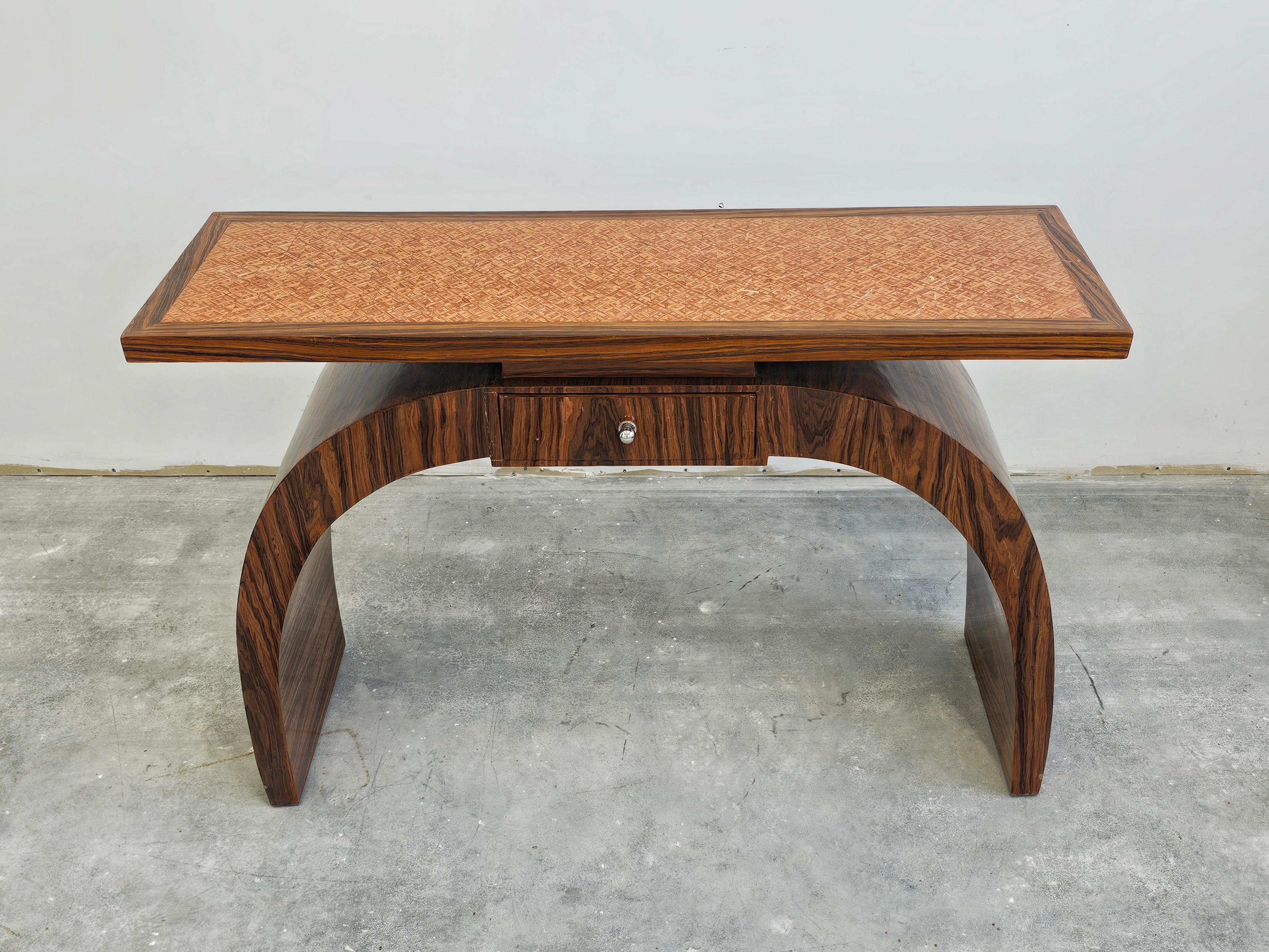 In this listing you will find a rare and extremely attractive console table with a drawer. It features semi-circular stand done in walnut veneer and a top done in mosaic veneer. Made in Austria in 1950s.

Good vintage condition with some signs of