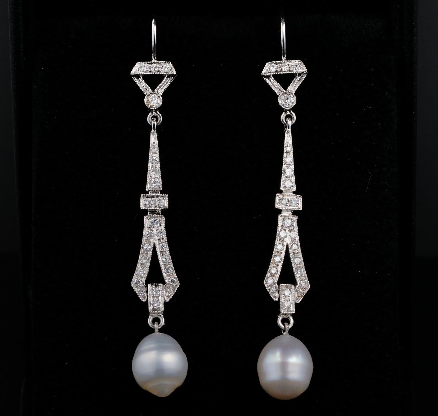 These gorgeous late Art Deco period long drop earrings are 1935
Elegant and timeless design expressed in top bow leading to a tasteful long geometric line, all set with transitional round cut Diamonds, ending with white cultured Baroque shaped salt
