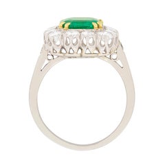 Late Art Deco Emerald and Diamond Cluster Ring, circa 1930s