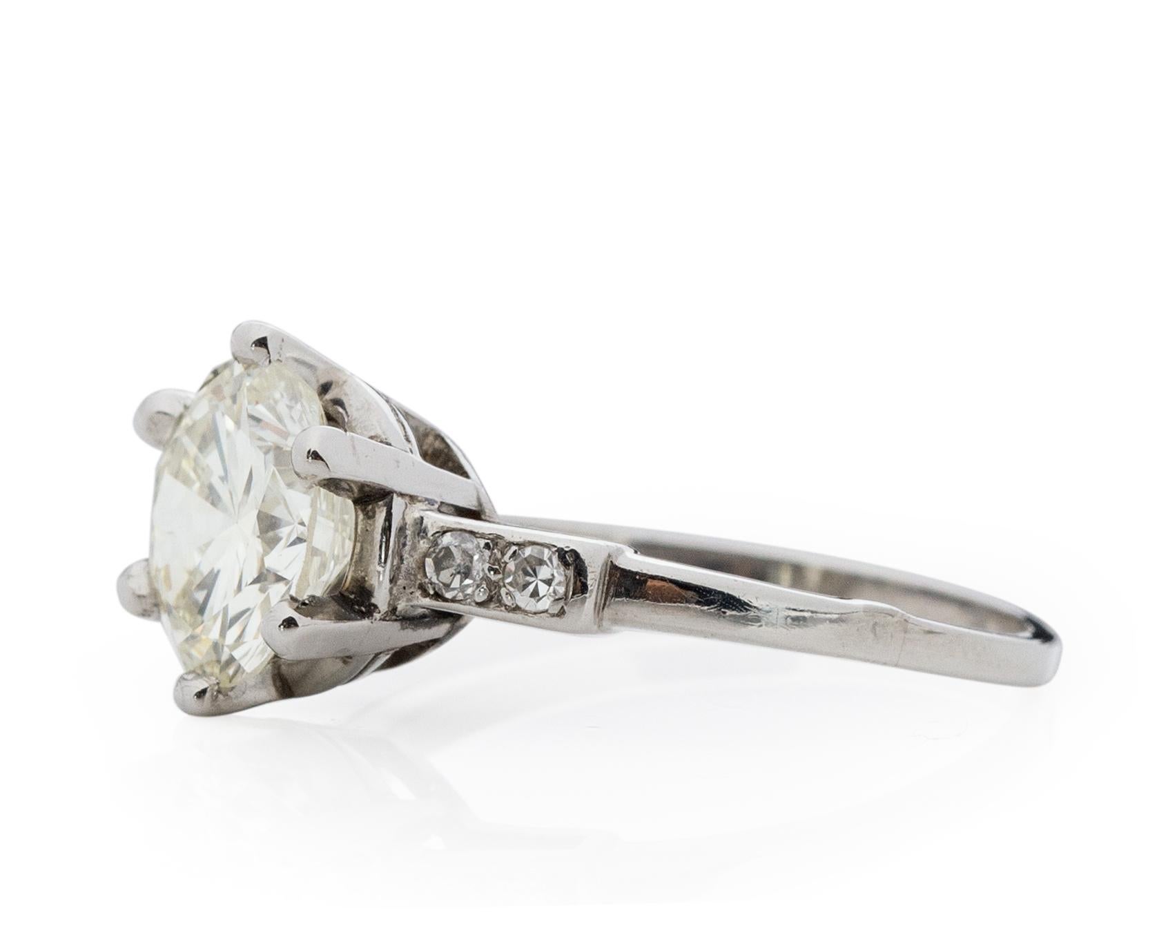 Here we have an beautiful example of an Art Deco era engagement ring! This genuine 1940's era ring features a stunning 2 Carat GIA certified transition cut diamond set beautifully in a simple yet elegant platinum ring. The beautifully crafted