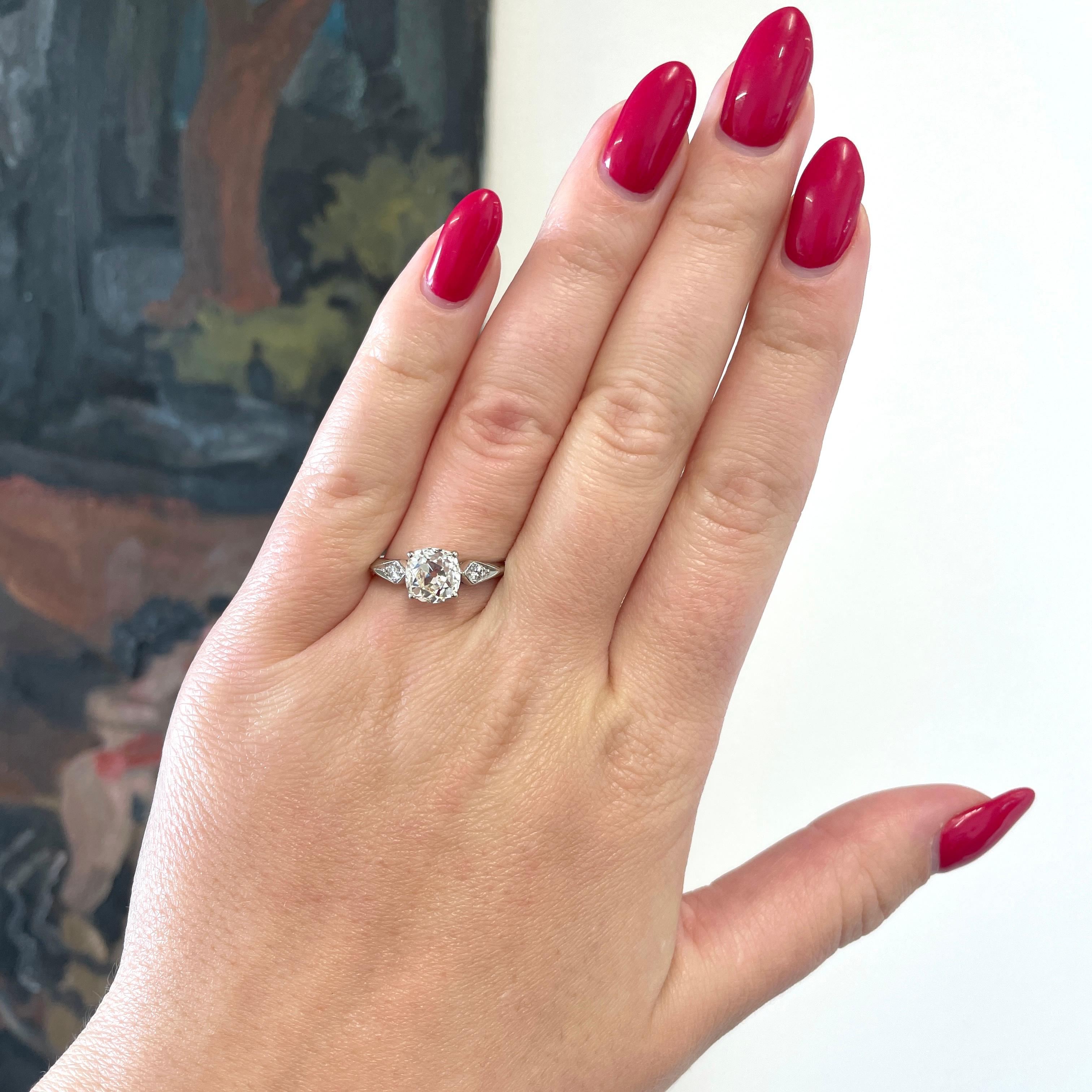 Timeless and classic, this ring is perfect to wear for the rest of your life. The ring speaks of history and will grace your finger with beauty. The center diamond is GIA certified as old Mine cut 2.12 carat, L color, SI2 clarity (#2211308823).