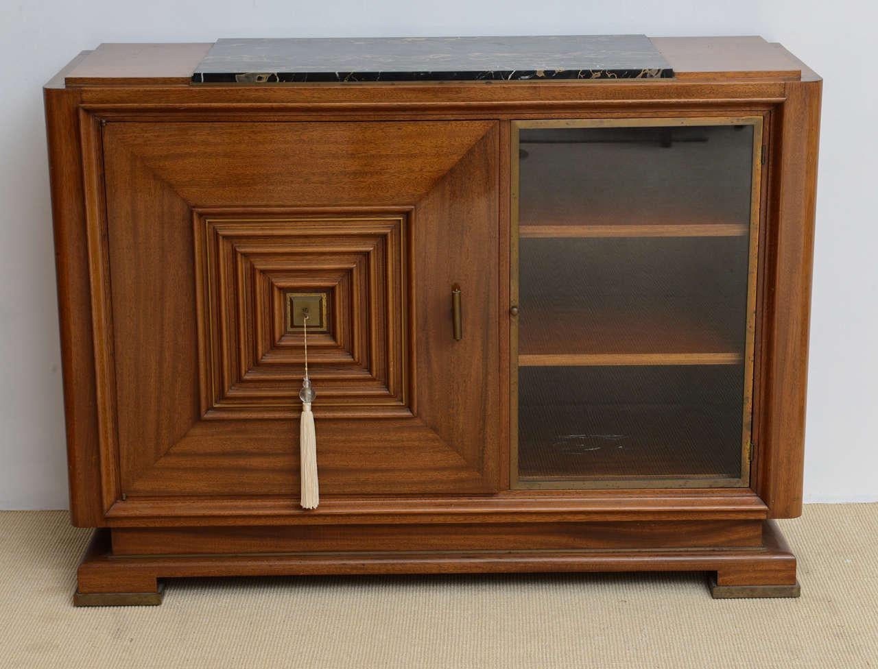 Art Deco mahogany, bronze-mounted credenza with inset marble top and glass front section.