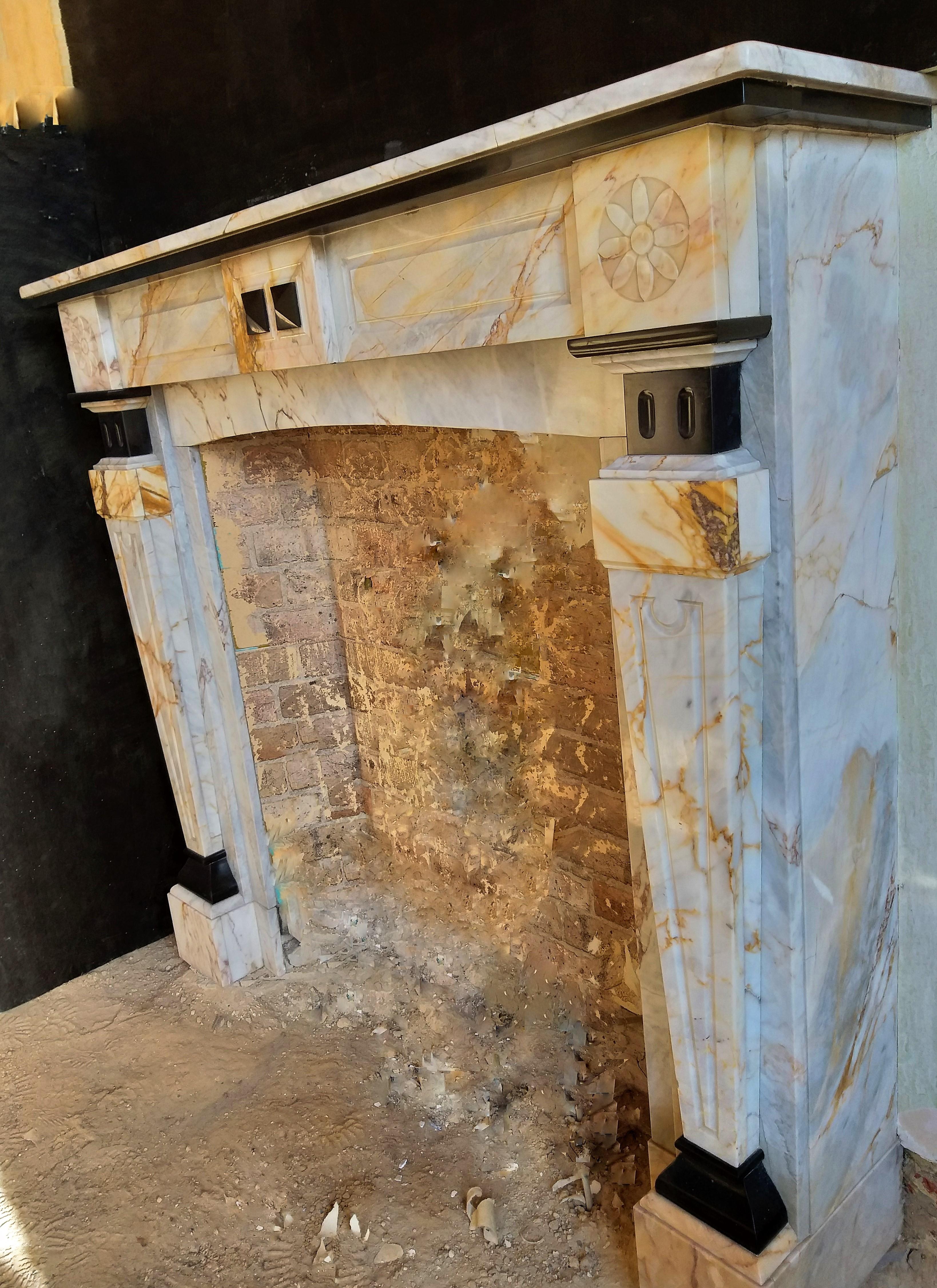 This late Art-Deco fireplace was made in 1931, in France. The marble is a highly-valued Paonazzo with Noir de Mazy parts for a vivid contrast. This fireplace has because of her young age maybe not such a long history, but what it does have is color,