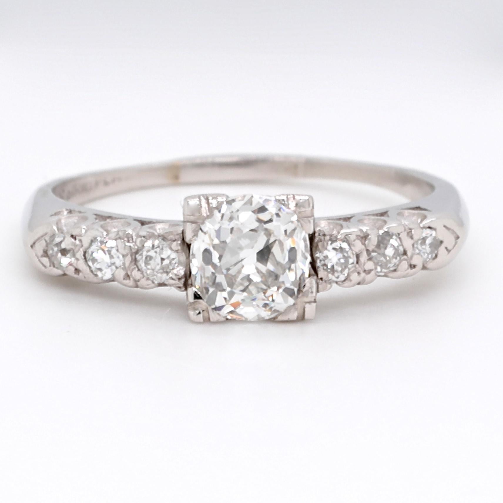 Are you looking for the perfect engagement ring? This timeless, classic beauty might be the one.  A symbol of true love, that's perfect for everyday wear. This is a Late Art Deco Diamond Platinum Ring. The center diamond is an old European cut,
