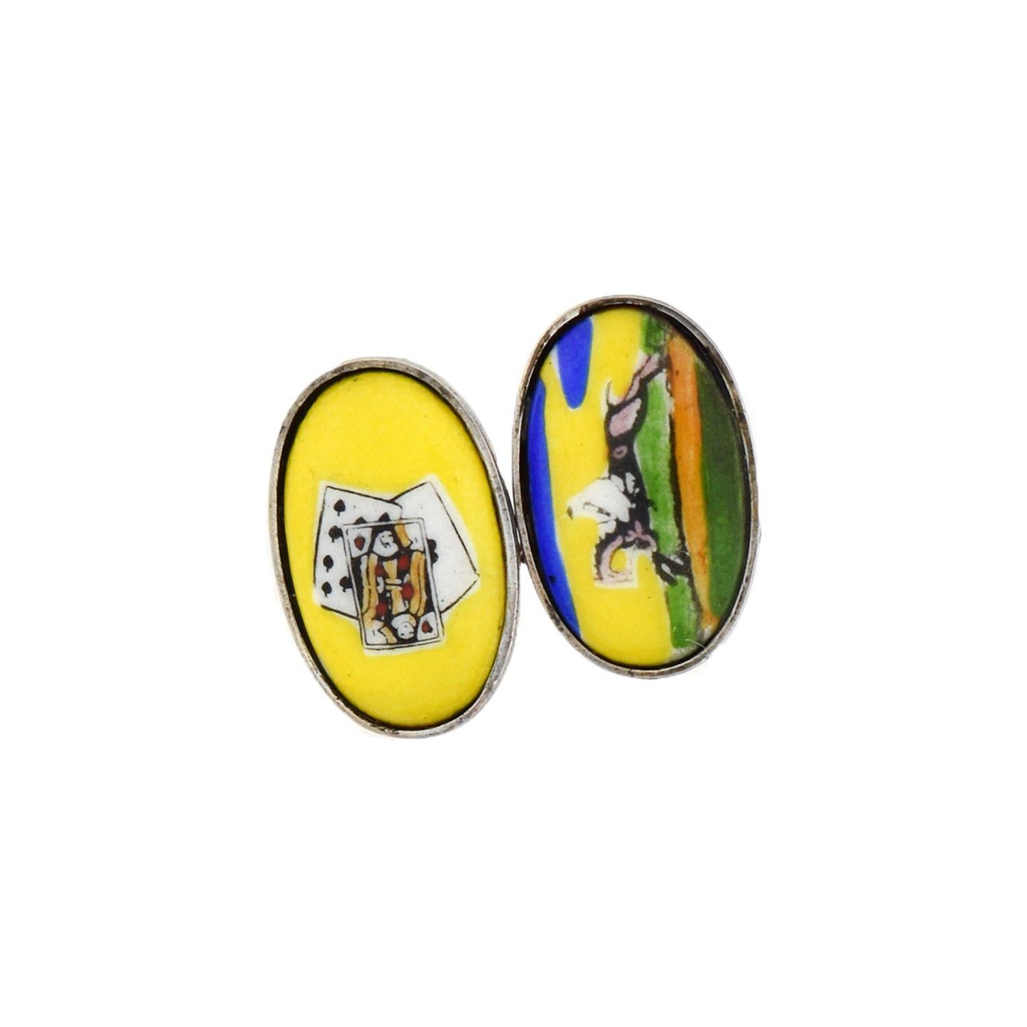 A unique and whimsical pair of porcelain cufflinks from the late Art Deco (ca1930) era! Crafted in sterling silver, these double-sided cufflinks each display an image depicting the now antiquated term 