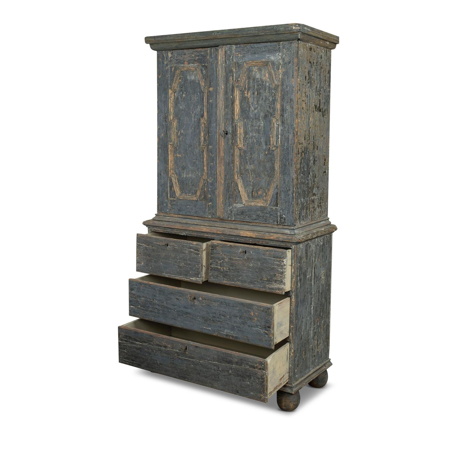 Late baroque Swedish cupboard (buffet a deux corps) scraped back to original and early layers of blue paint (with remnants of green and beige). Constructed circa 1720-1740 using mortise and tenon joints. Decorated in trim molding. Cupboard consists