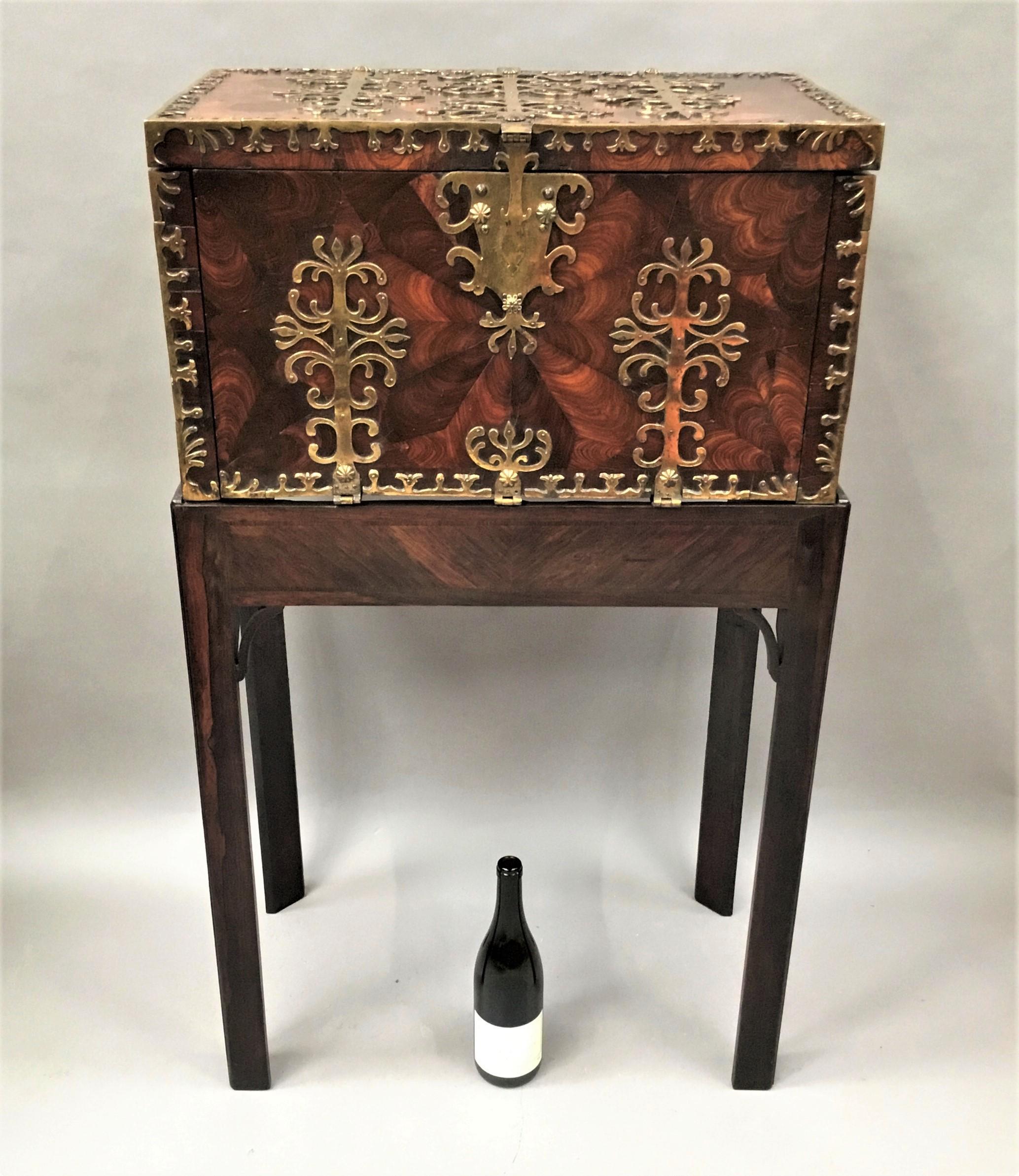 An exceptional late 17th century large oyster kingwood coffre forte / strong box of extremely rare, large, proportions. The whole casket with striking oyster veneers throughout and profusely decorated with gilt brass foliate design strapwork. The