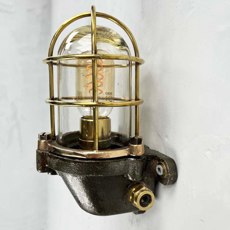 Industrial Late Century British Cast Steel, Brass & Bronze Wall Light, Cage & Glass Shade For Sale