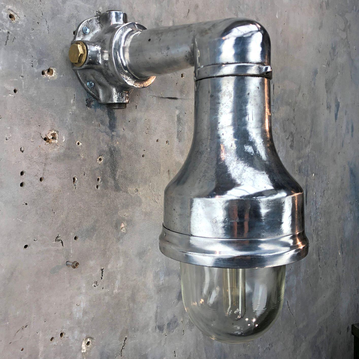 A substantial Industrial style aluminum outdoor wall light, reclaimed from cargo ships. Professionally restored by Loomlight in the UK ready for modern use. 

These would look outstanding mounted in pairs around a large door. 

Manufactured