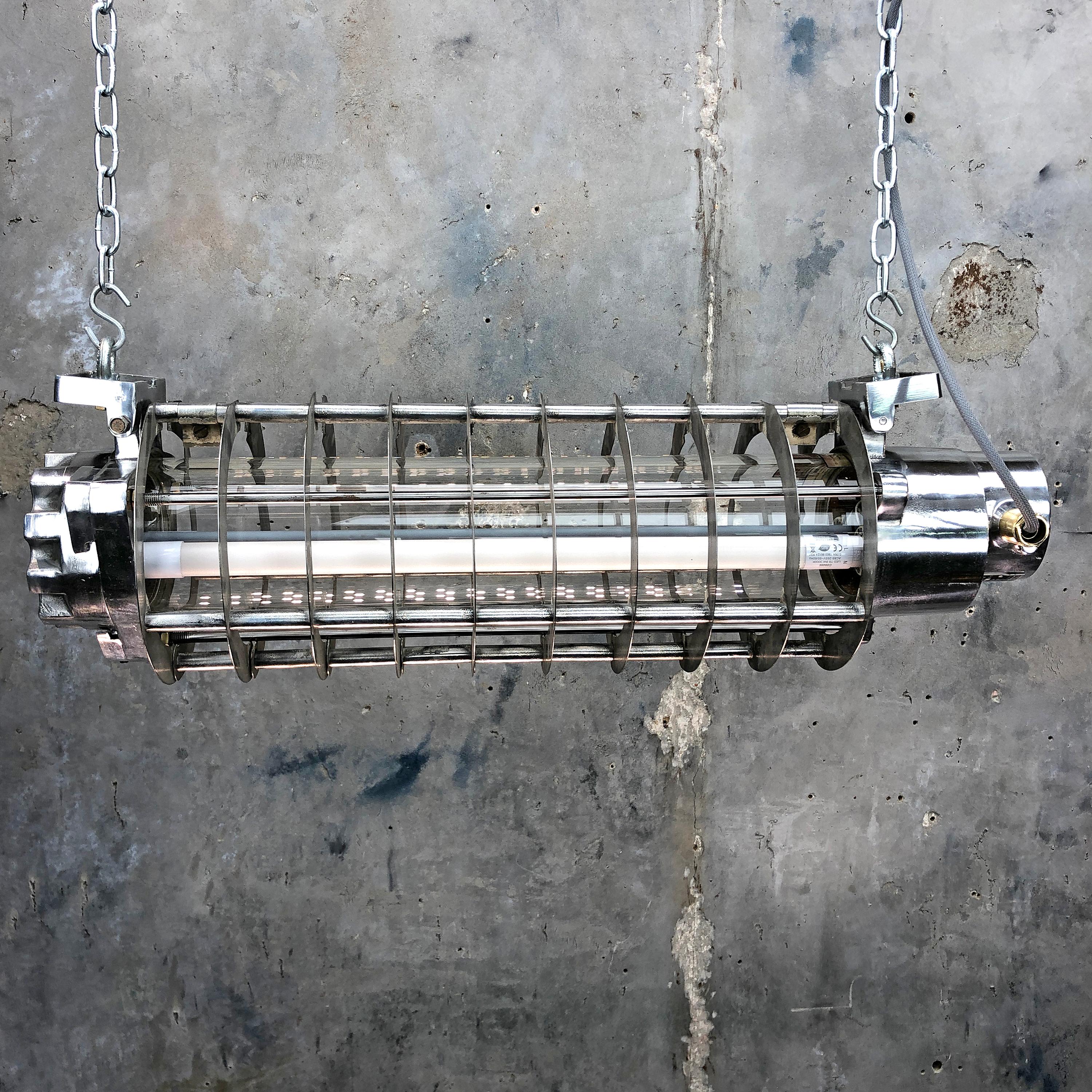 A vintage industrial aluminium flameproof striplight with protective cage and LED tubes. Reclaimed from decommissioned supertankers and military vessels then professionally restored and rewired in the UK by Loomlight.

All of our tube lights are