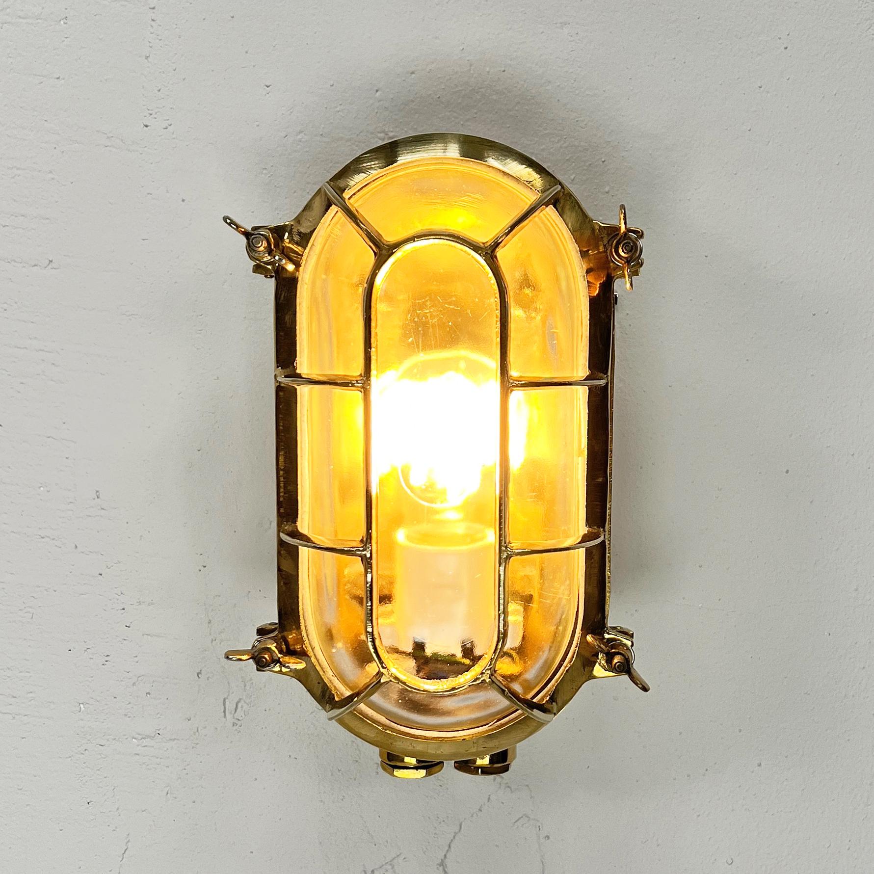 Cast Late Century German Brass Oval Wall Sconce with Oval Cage & Glass Shade  For Sale