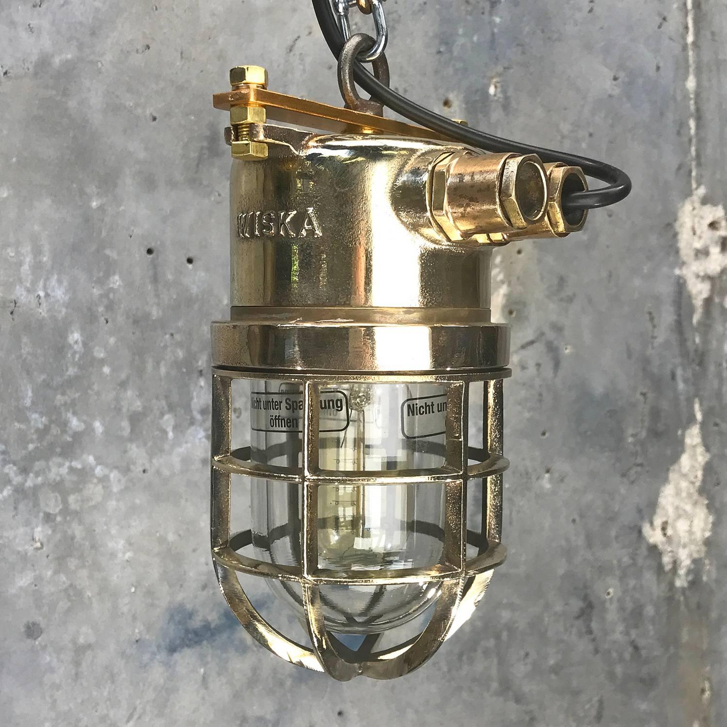 Solid cast brass explosion proof pendant manufactured circa 1980. Ex. rated and reclaimed from supertankers.
 
It has the original ceramic and brass E27 lamp holder which looks brand new, and is completely free from chips / damage. 
 
Reclaimed