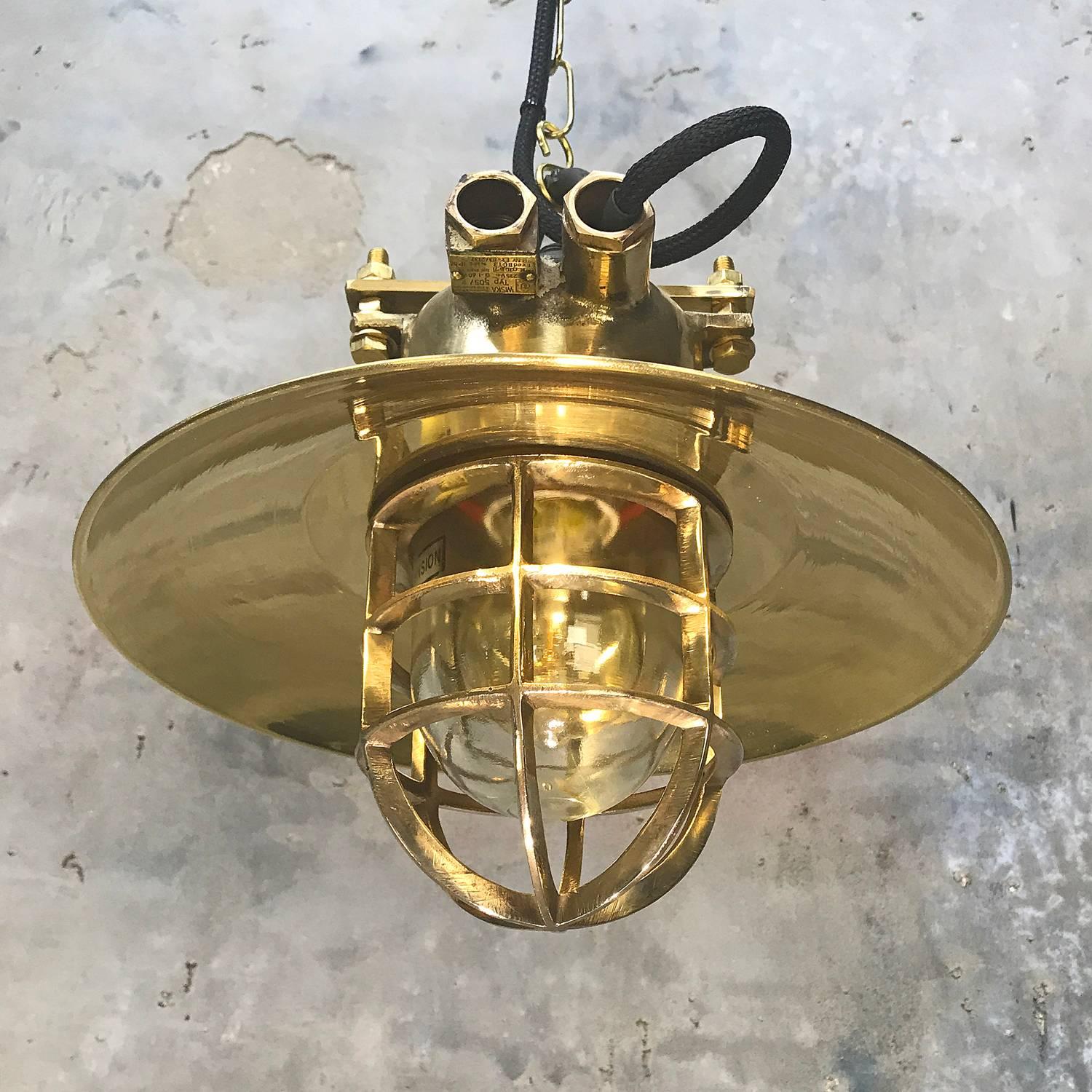 A reclaimed vintage industrial brass and bronze explosion proof ceiling pendant by Wiska.
 
Originally marine lighting fixtures reclaimed from super tankers and cargo ships built in the 1970's.  Professionally restored and converted to pendants by