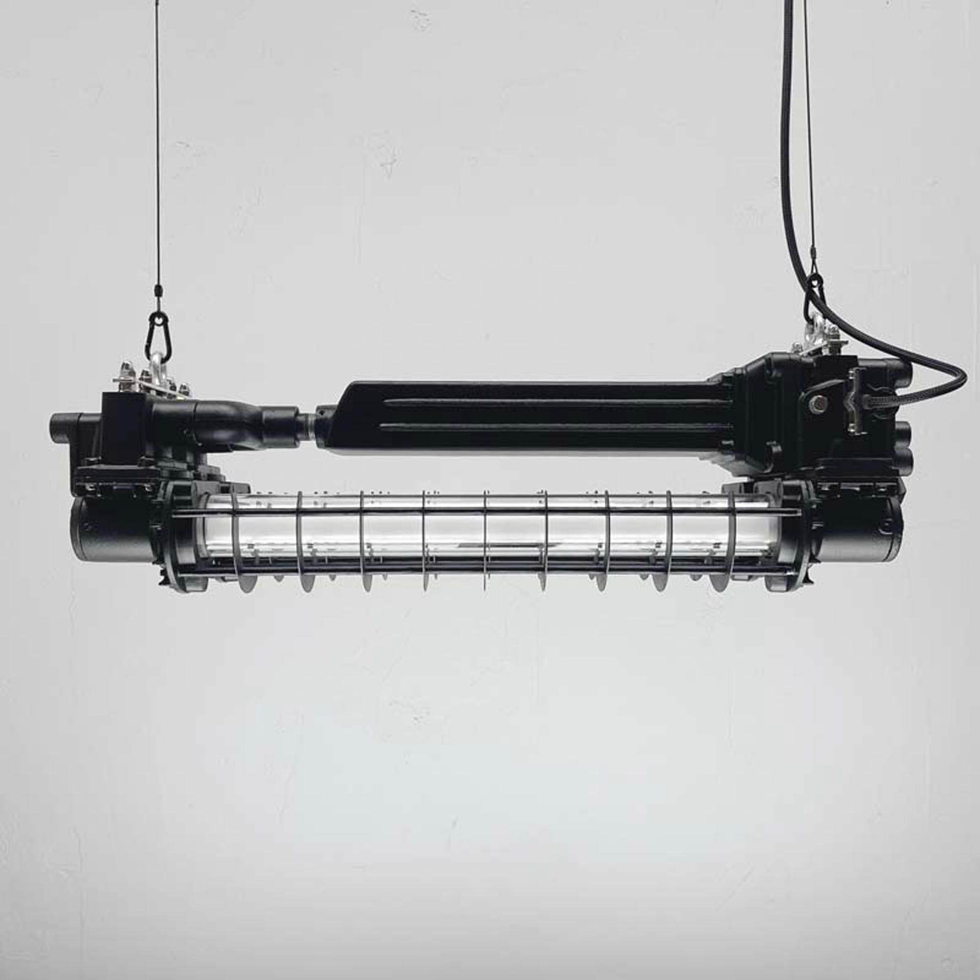 A black caged industrial strip light. A reclaimed aluminium ceiling light refinished with matte black paint. We have rewired these fixtures with new electrical components and fitted two LED T8 dimmable tubes. 

Specifications

Width: 76cm
Depth: