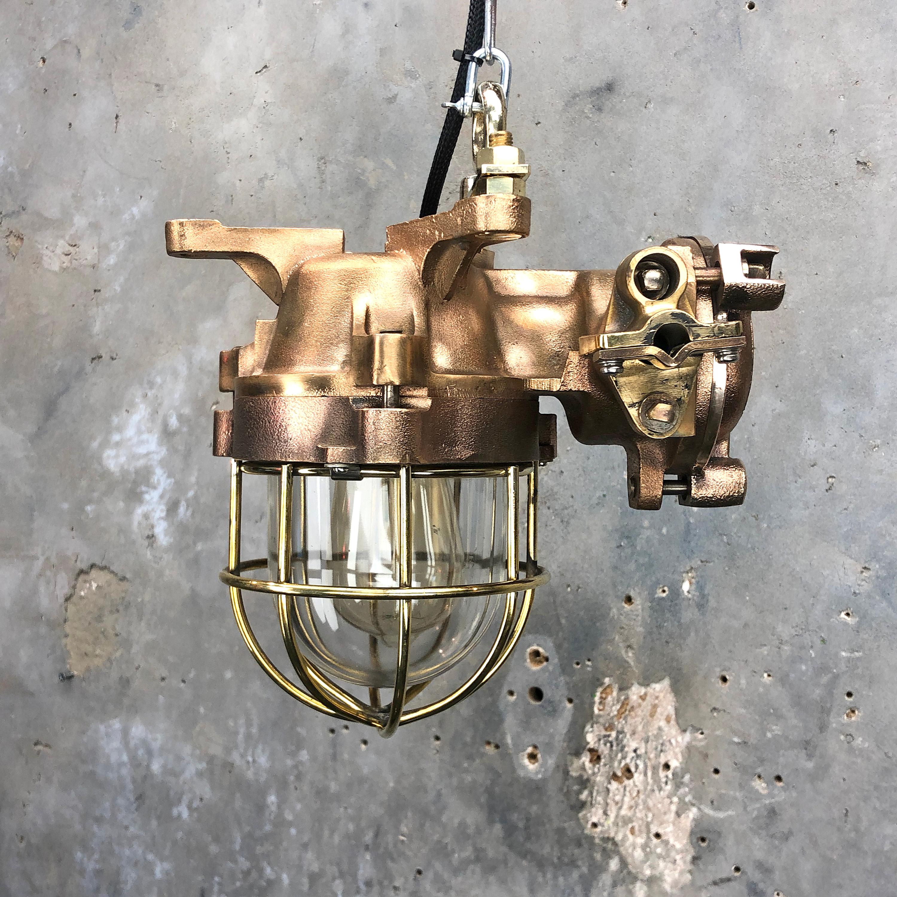 Vintage Industrial Japanese flameproof cast bronze ceiling light fitted with Edison squirrel cage filament bulb made in the 1990s by Kokosha - Osaka, Japan. These fixtures also feature brass cable grips and brass wire cage.

These flameproof rated