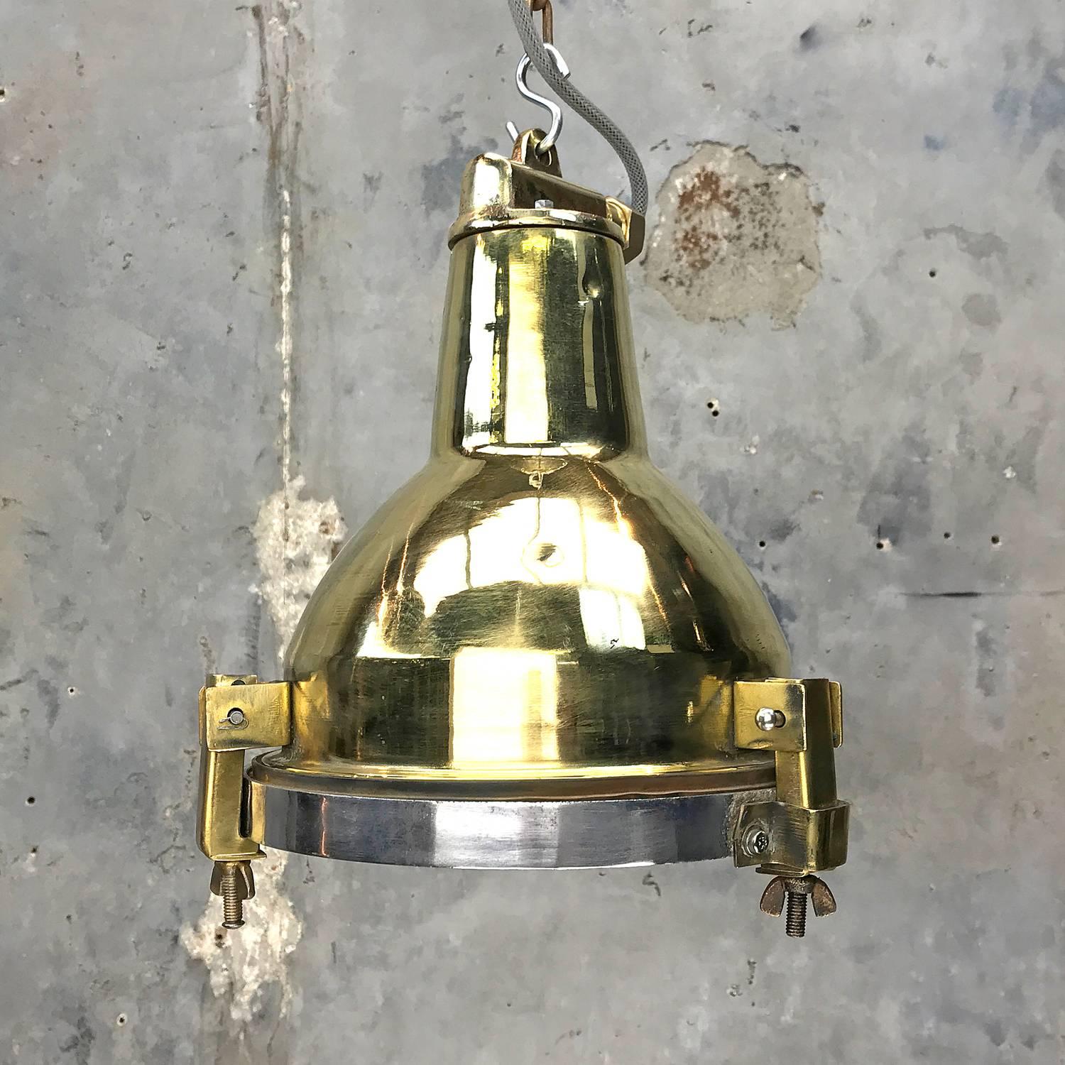 A great compact lighting solution made from brass and aluminium.

Originally these would have highlighted smaller areas on cargo ships where more architectural illumination is required.

The bulk of the light is made from spun brass with the top