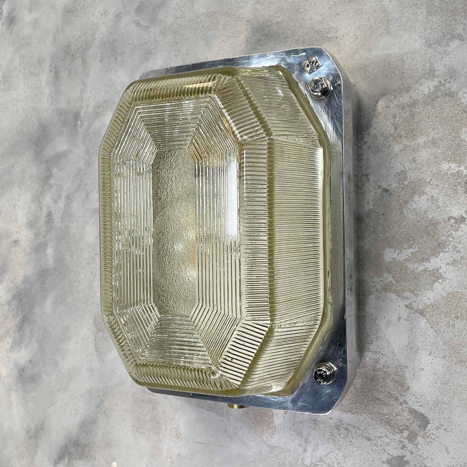 Are British made bulkhead lamp by Victor a manufacturer of lighting for use in hazardous locations such oil rigs, mines and large sea going vessels.

The main body of the lamp is reeded / prismatic glass which gives a soft diffusion output of