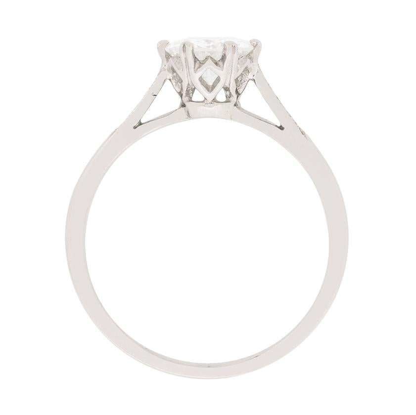This beautiful solitaire ring dates back to the 1940s and is wonderfully art deco in design. The beautiful transitional cut diamond weighs 0.79 carat and has an independent certificate from EDR (European Diamond Reporting). They have graded the