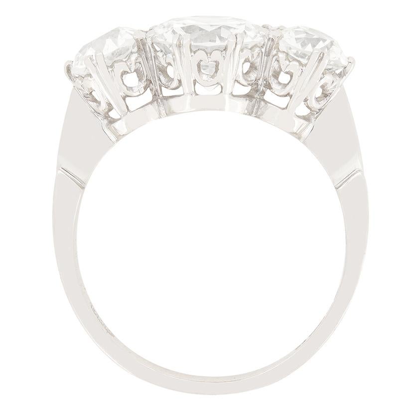 This stunning Late deco three stone ring features a trio of sparkling old cut diamonds The central stone sits the largest at 1.90 carat with each of the flanking stones weighing 0.65 carat a piece. The trio range in colour from G to H, and match in