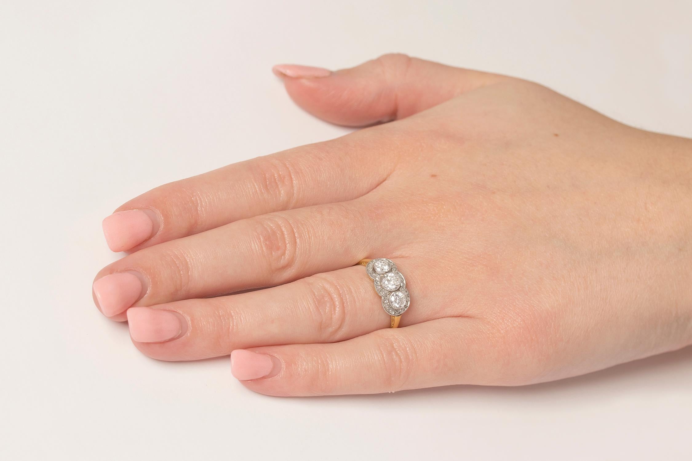 Late Deco Diamond Three-Stone with Diamond Halo Ring, circa 1940s In Good Condition For Sale In London, GB