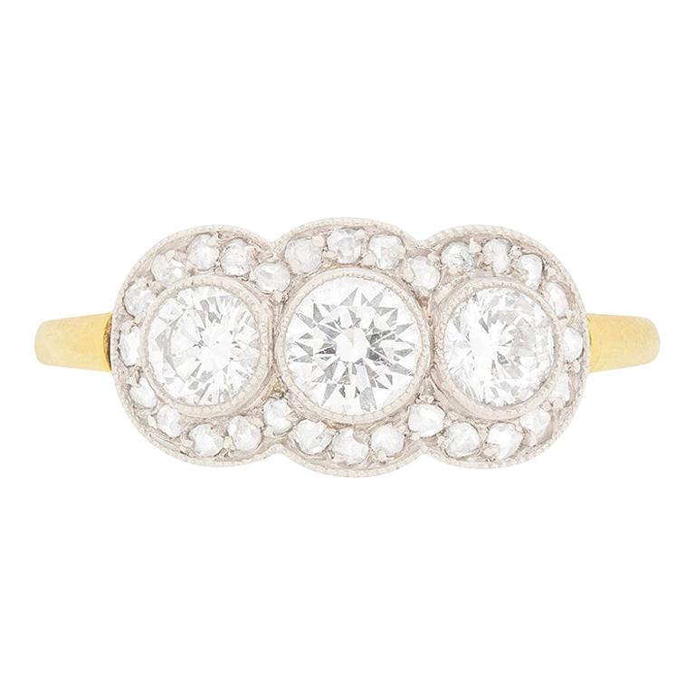 Late Deco Diamond Three-Stone with Diamond Halo Ring, circa 1940s