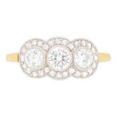 Vintage Late Deco Diamond Three-Stone with Diamond Halo Ring, circa 1940s