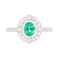 Late Deco Emerald and Diamond Cluster Ring, circa 1940s