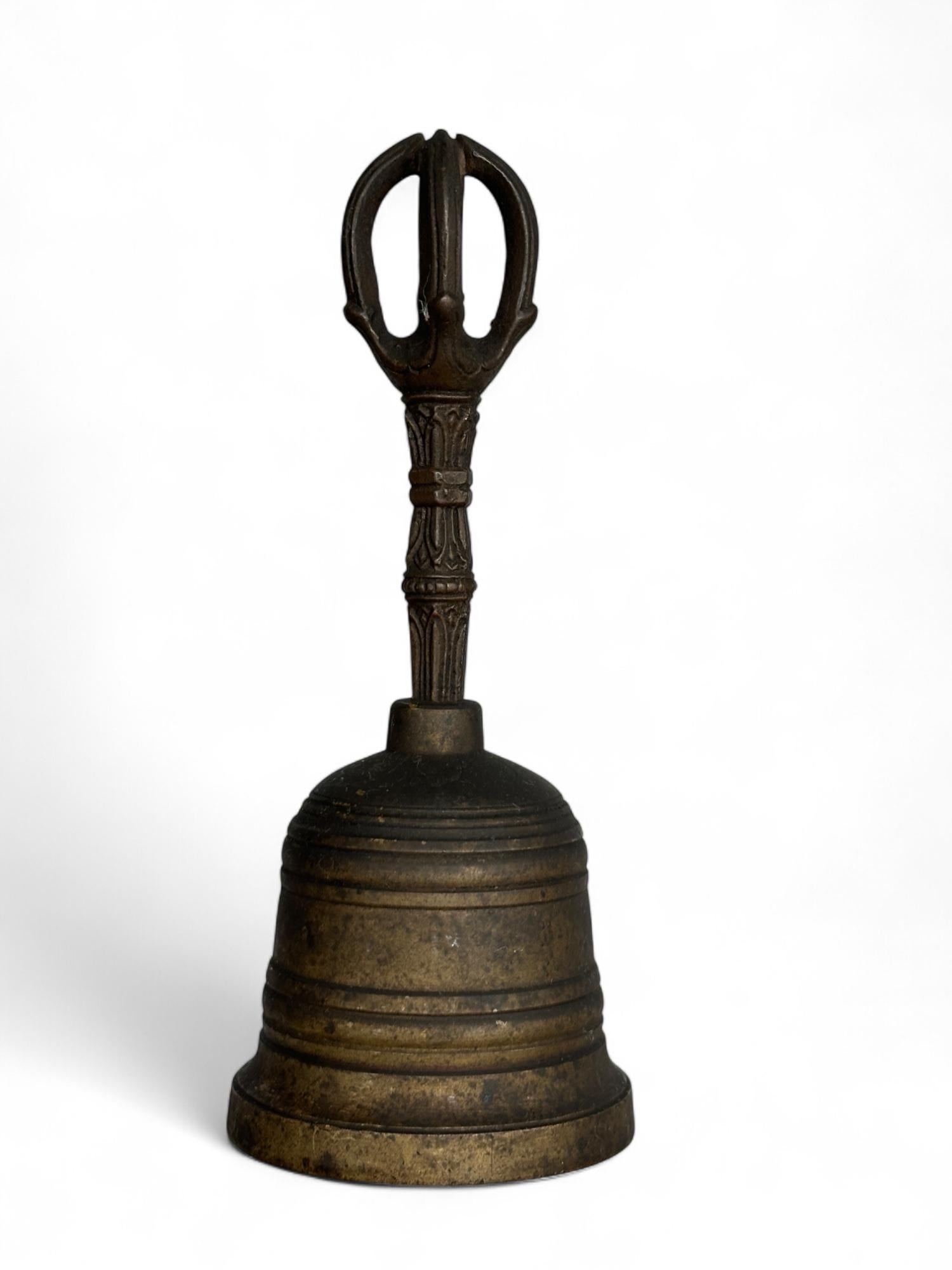 A finely cast ritual bell (ghanta) from the late Edo period (c. mid-19th century), made of brass with a five-pronged vajra (go-kosho) handle. This sacred implement would have been used in esoteric Buddhist rites, especially within the Shingon or