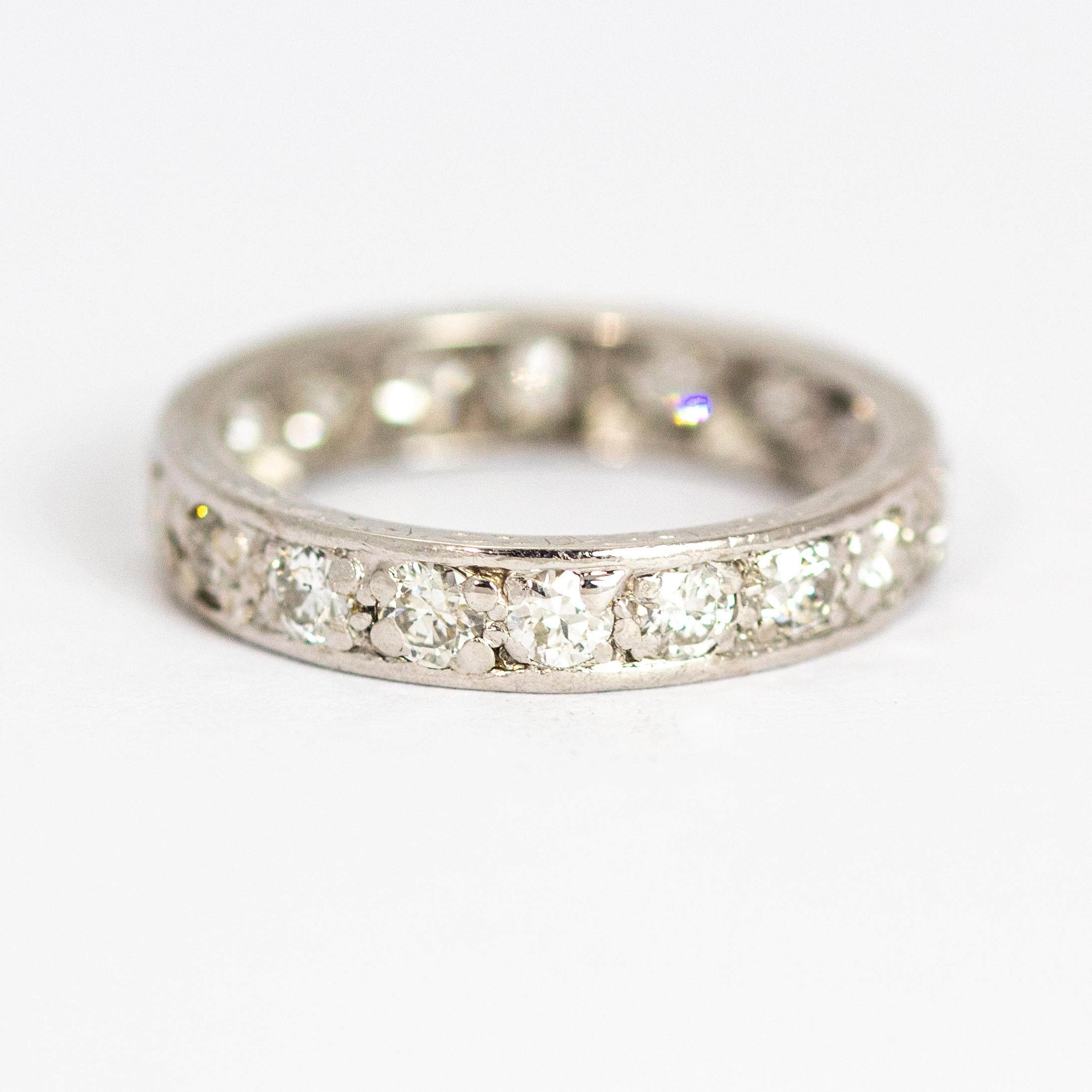This sparkling eternity band holds a total of 2 carats of brilliant cut Diamonds all set in platinum. The shimmer on this ring is simply stunning! To add to the beauty of this ring there is soft engraving in the platinum. 

Ring Size: O or 7