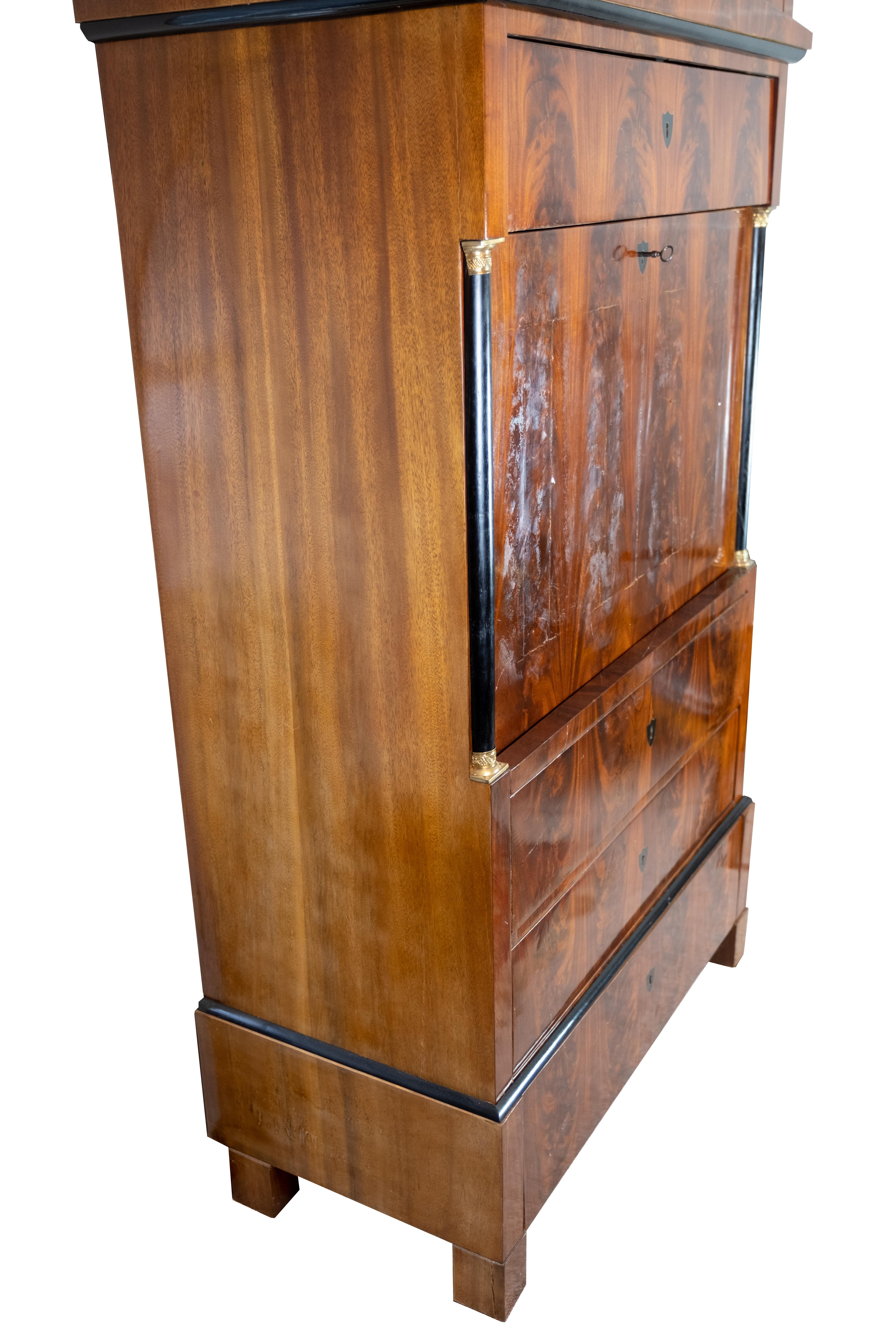 Late Empire cabinet of handpolished mahogany and of cherry on the inside, from Denmark around the 1840s. The cabinet is in great antique condition.

 