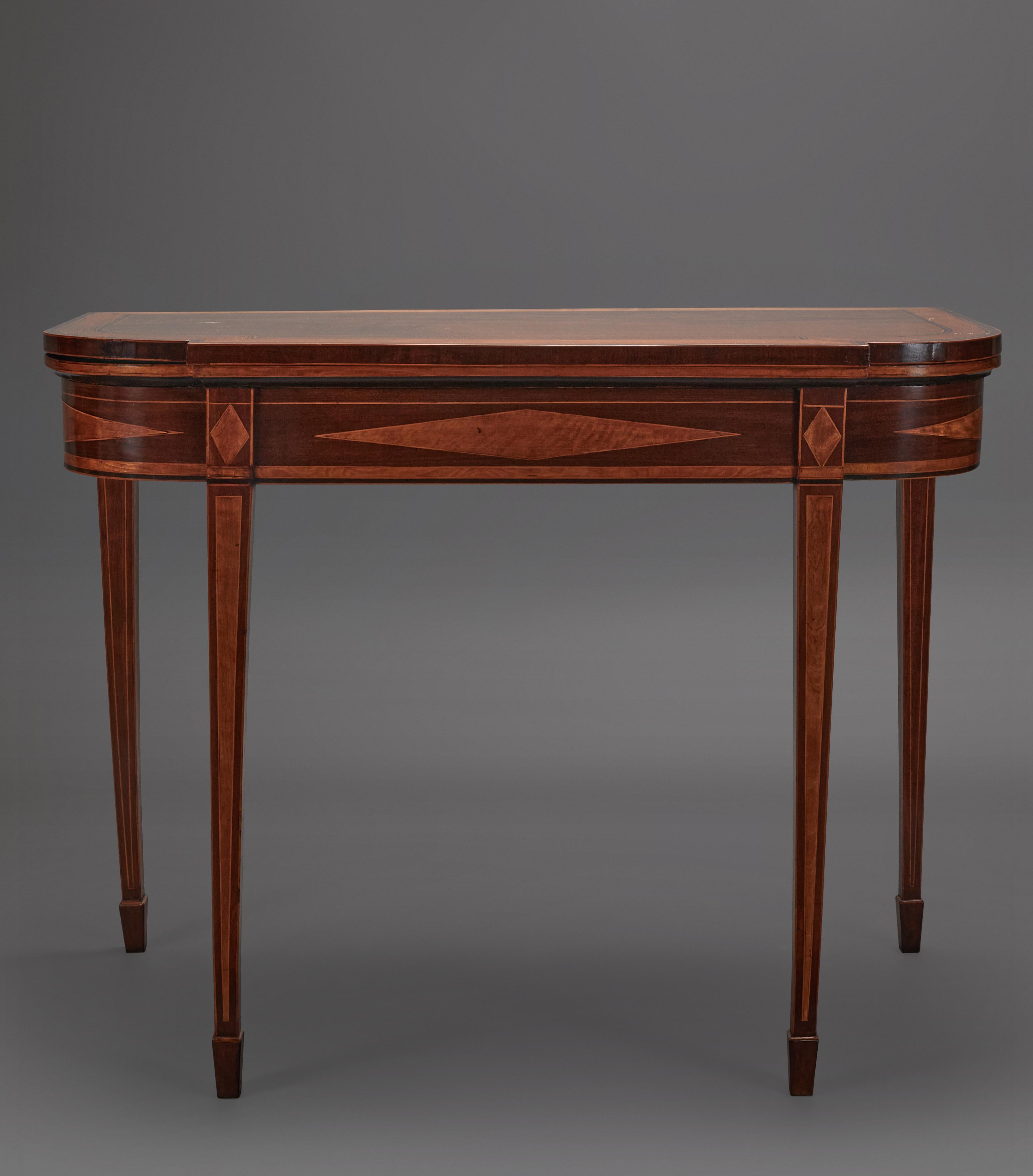 Mahogany and satinwood banded and inlaid that opens up to a felt top. 4 squared legs, 2 that are hinged and pull out for opened position. Brass hardware. table open: 36 1/2