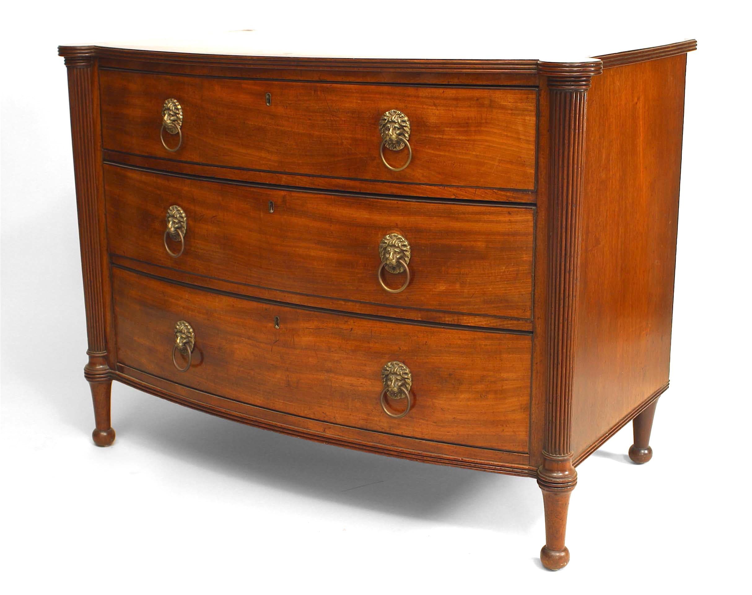 English Late George III (circa 1800) mahogany bow fronted chest of drawers with 3 long drawers with lion mask pulls & flanked by reeded outset angles.
