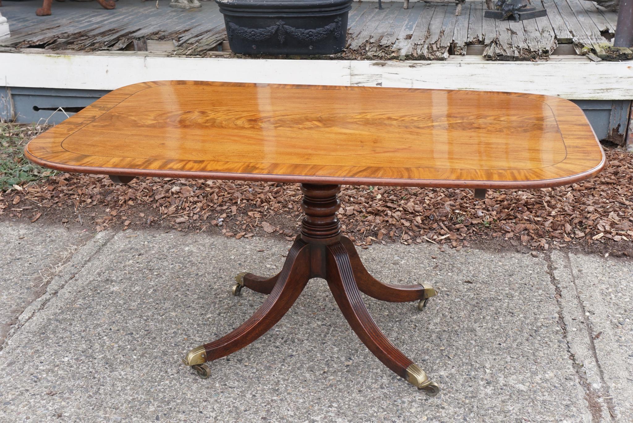 This fine period table, circa 1790-1800, is made of the finest imported Cuban mahogany. This kind of board lumber was a prized material from England's great Colonial holdings and would have cost 5 or 6 times the amount of the best local timbers. The