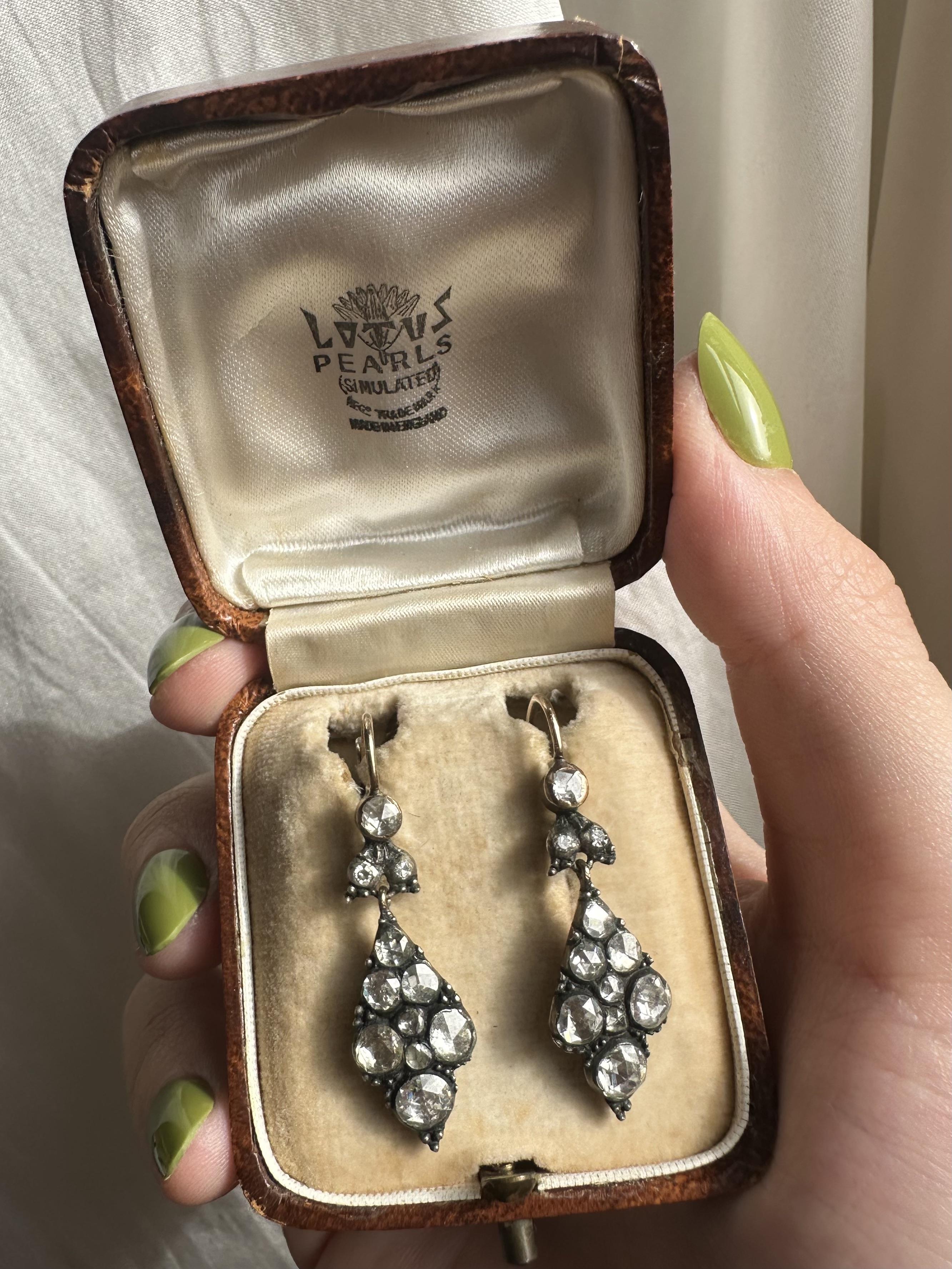 This exquisite pair of late Georgian earrings features approximately 2.50 carats of rose-cut diamonds, set in gold and silver. Designed with a 1.50-inch drop and weighing 5.9 grams, they are both lightweight and striking, showcasing the era’s