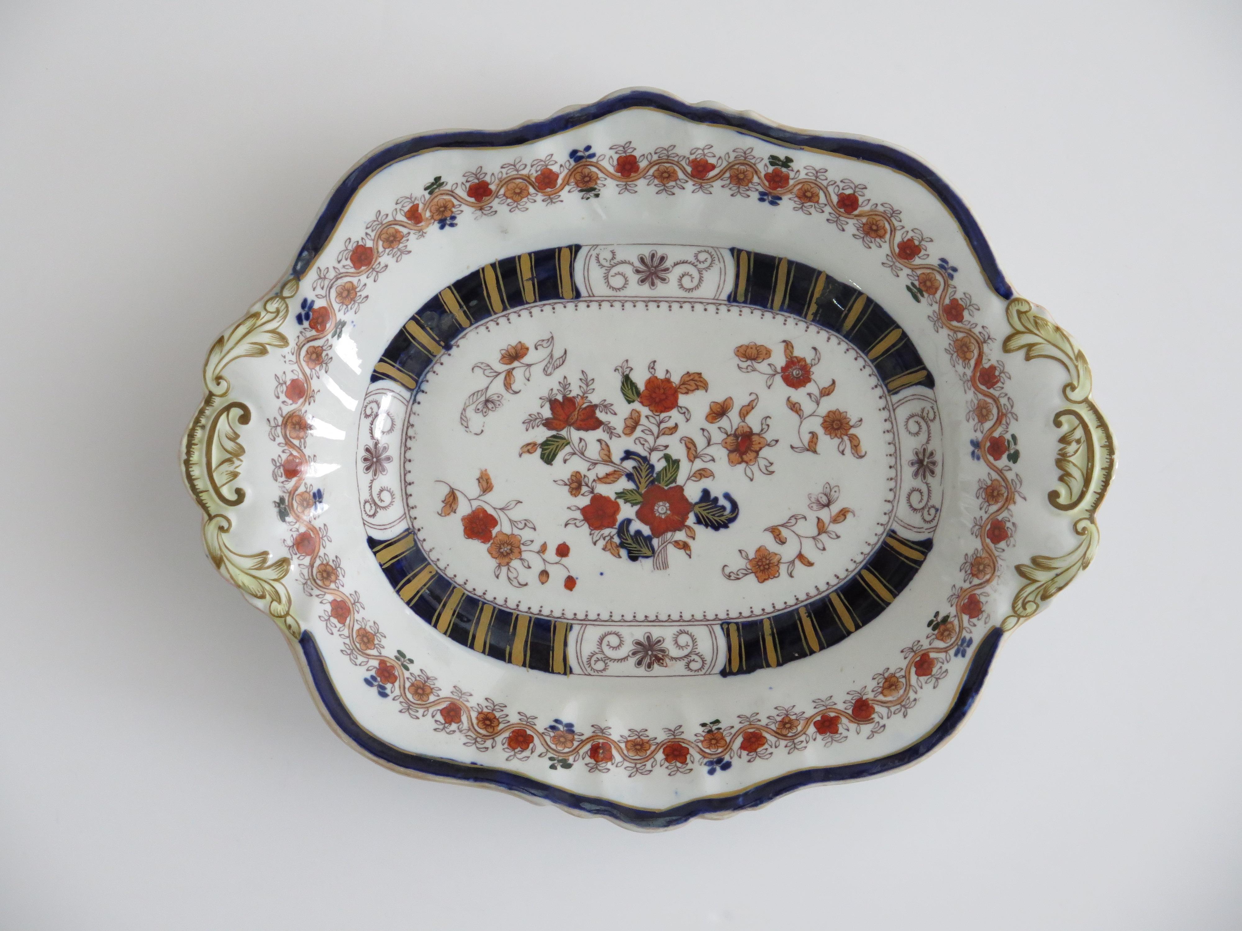 This is a very decorative serving dish or platter, made by Mason's Ironstone, Lane Delph, England in a very colourful floral pattern, dating to the late Georgian English Regency period, circa 1825 to 1830.

This Desert dish or platter has a