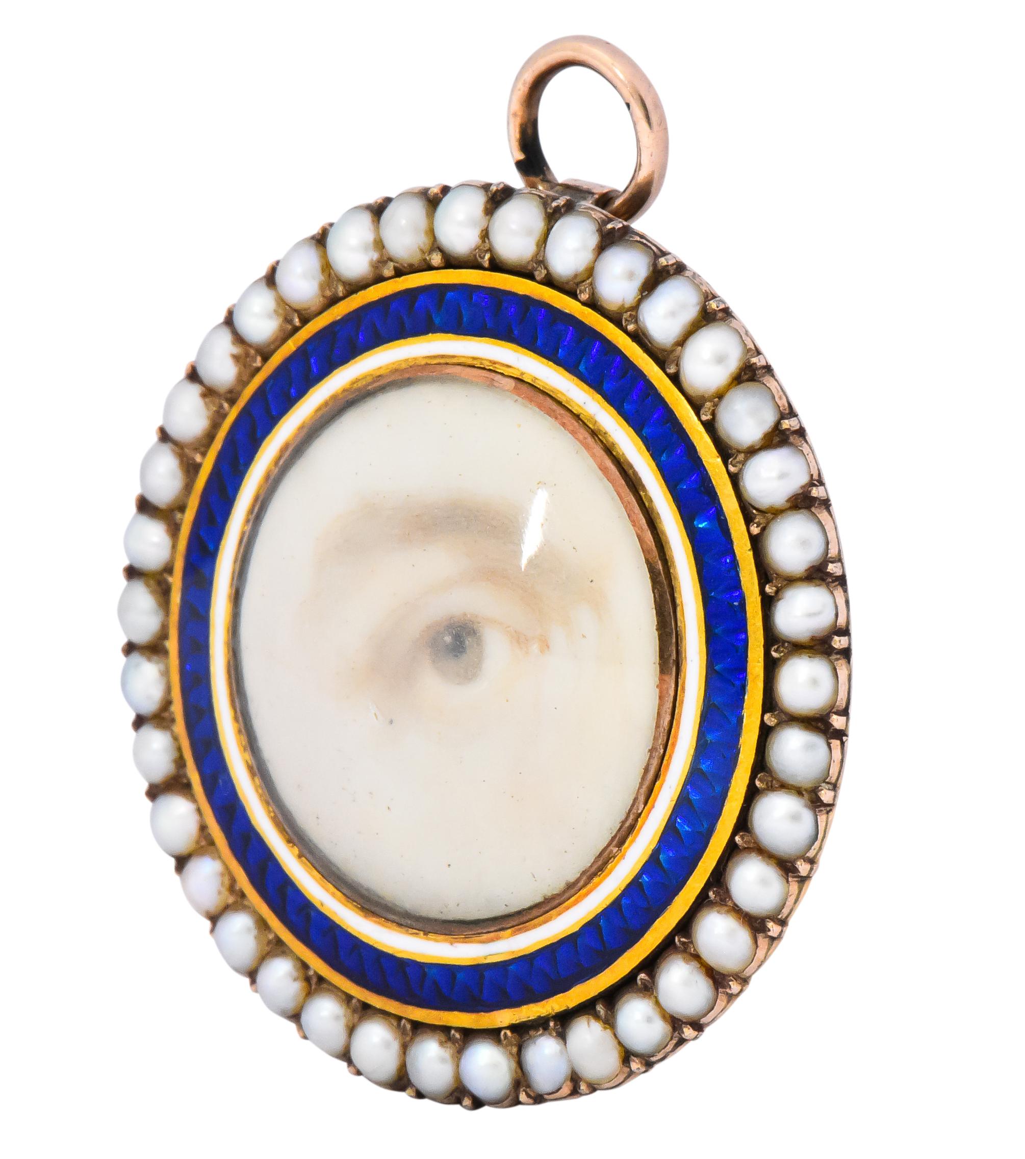 Featuring a diminutive hand-painted picture of an eye

With a white and bright royal blue surround 

Delicate seed pearl frame

With pin stem and fold-down bale 

12 karat or higher gold

Popular gift between lovers in the early to mid 19th century