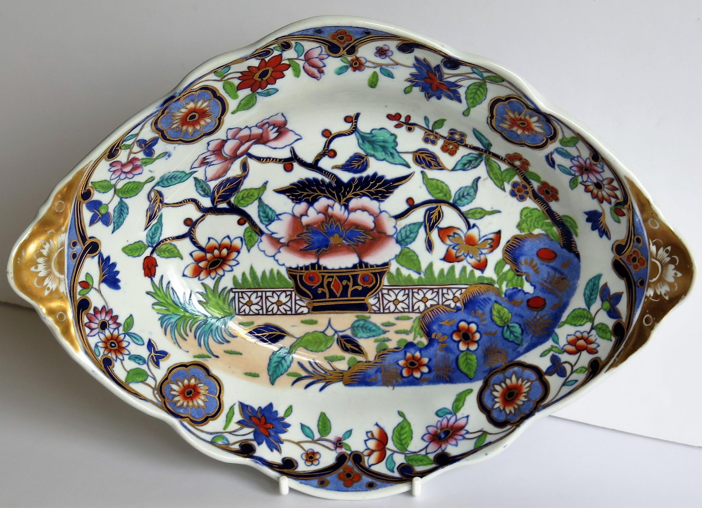 This is a beautiful ironstone dish, bowl or oval plate, produced by the Spode factory, during the late Georgian period, circa 1820.

The dish has an oval shape with fluted sides, a scalloped edge rim and carrying handles formed at either side.

The