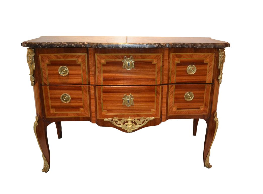 A gilt bronze mounted kingwood and tulipwood two drawer commode stamped Schlichtig of the late Louis XV period, (circa 1770). The commode also bears the JME stamp, (for jurande des menuisiers-ébénistes), which was added once a committee made up of