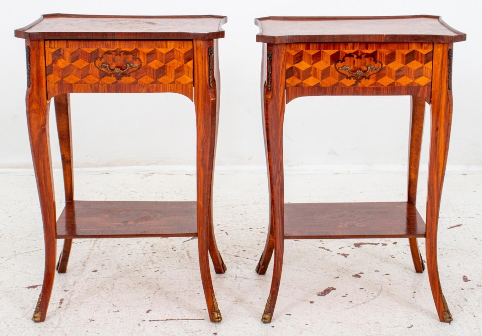 Pair of late Louis XV / early Louis XVI transitional marquetry side tables or end tables with shaped rectangular tops centering marquetry bouquets of flowers against a geometric ground above single drawers on cabriole legs conjoined by an entretoise