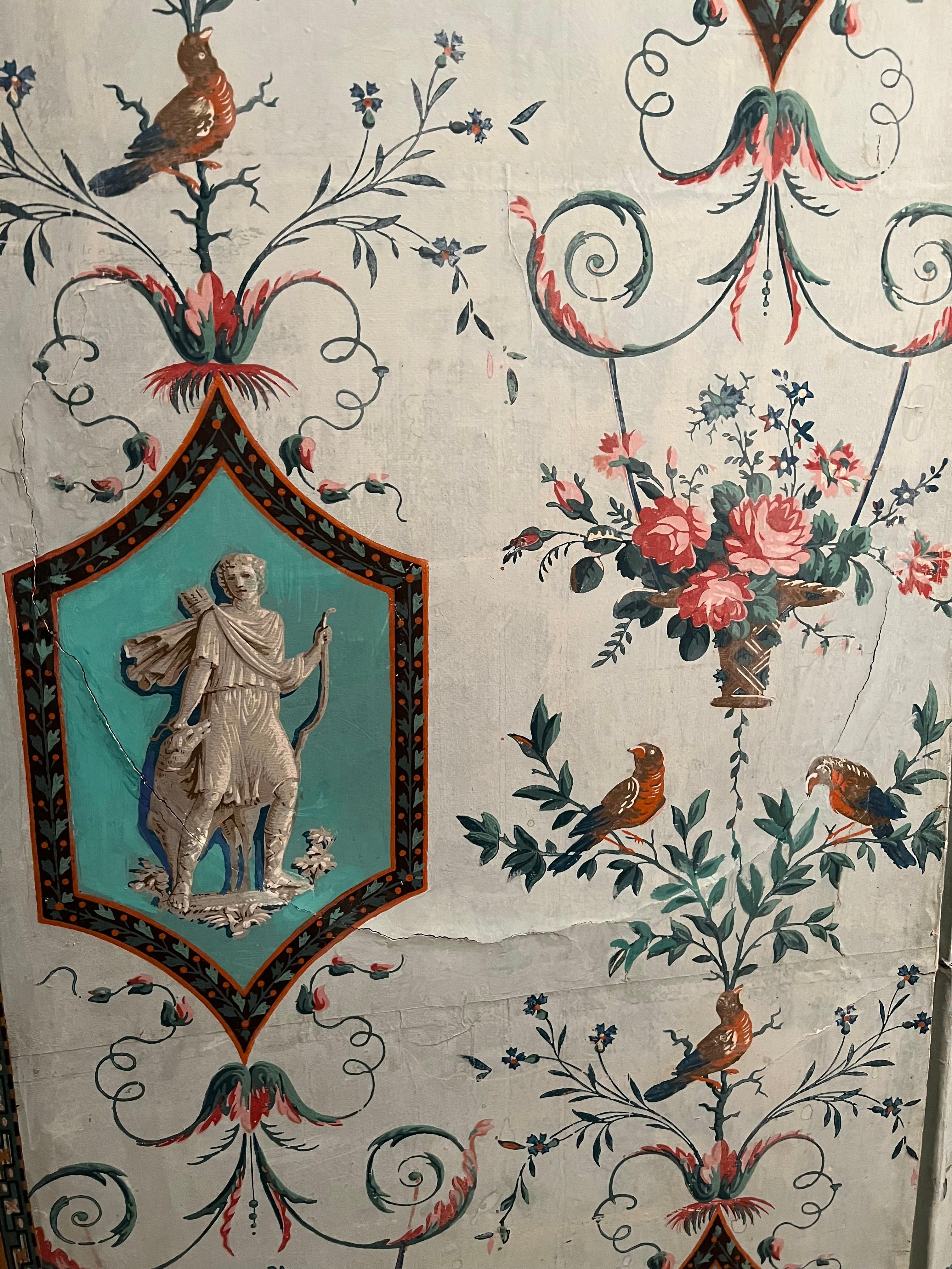 A late Louis XVI papier peint four fold screen probably from the Reveillon factory.
Depicting grisaille medallions of Diana on turquoise blue ground interspersed with arabesques of birds and flowers.