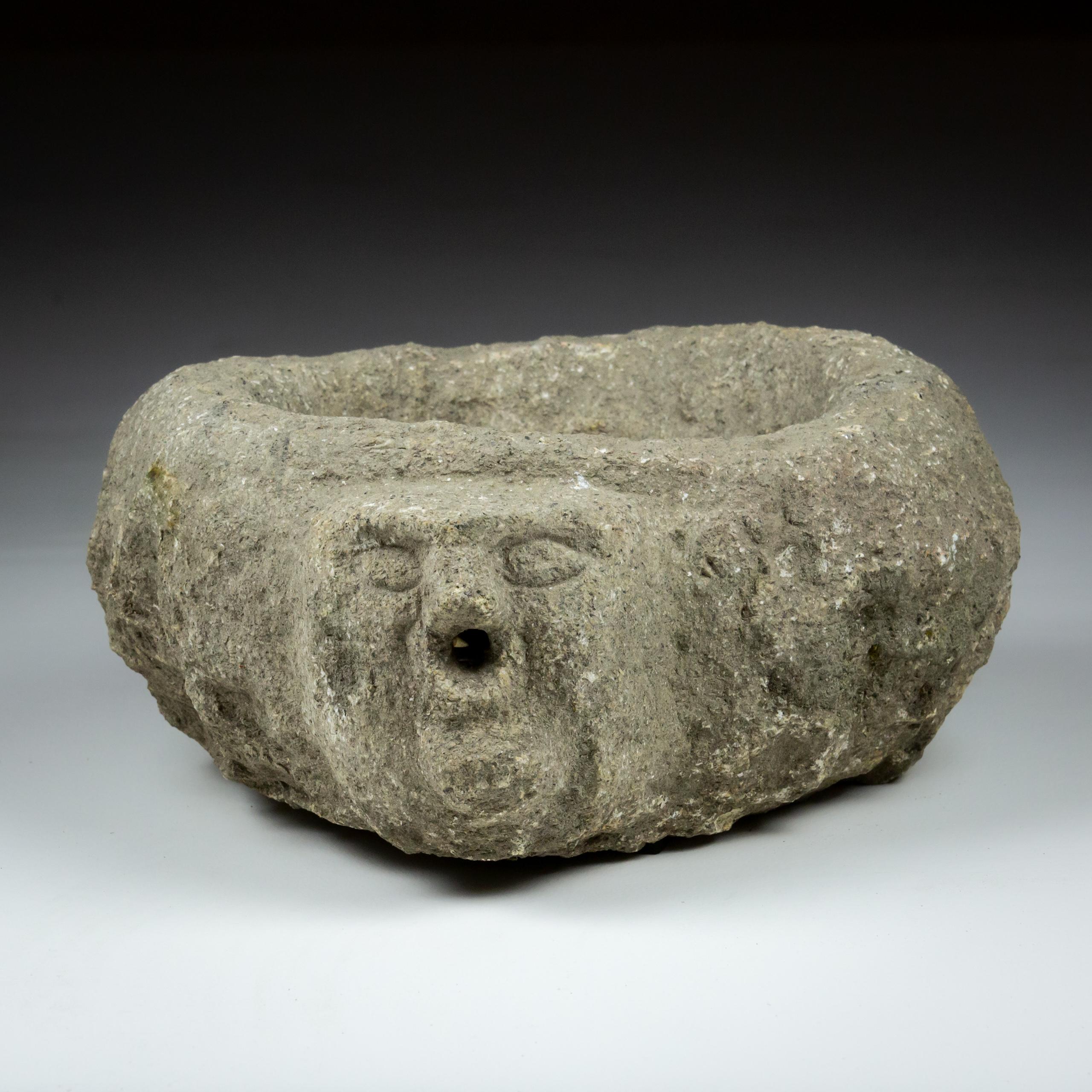 French Late Medieval Granite Benitier or Stoup with Primitive Head as the Water Spout For Sale
