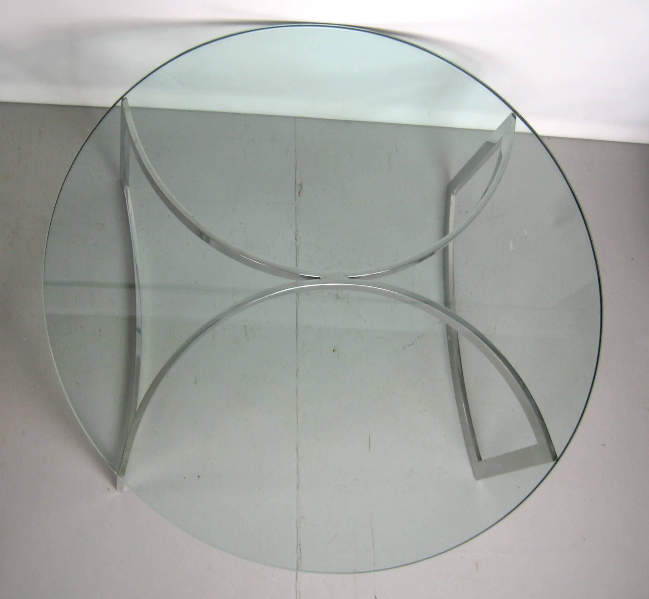 Stunning round glass topped coffee table. Heavy glass top on this wonderful modernist table.