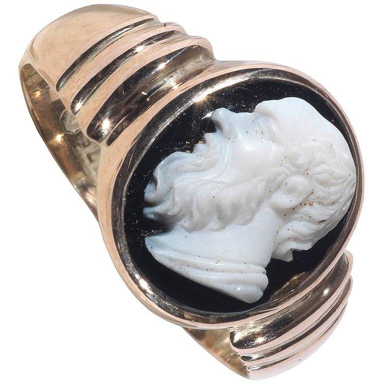 Gold ring set with a black agate cameo depicting the profile of an ancient philosopher (Socrates), 15 x 12 mm.
Size 8 3/4

Socrates  was a classical Greek philosopher credited as one of the founders of western philosophy. He is an enigmatic figure