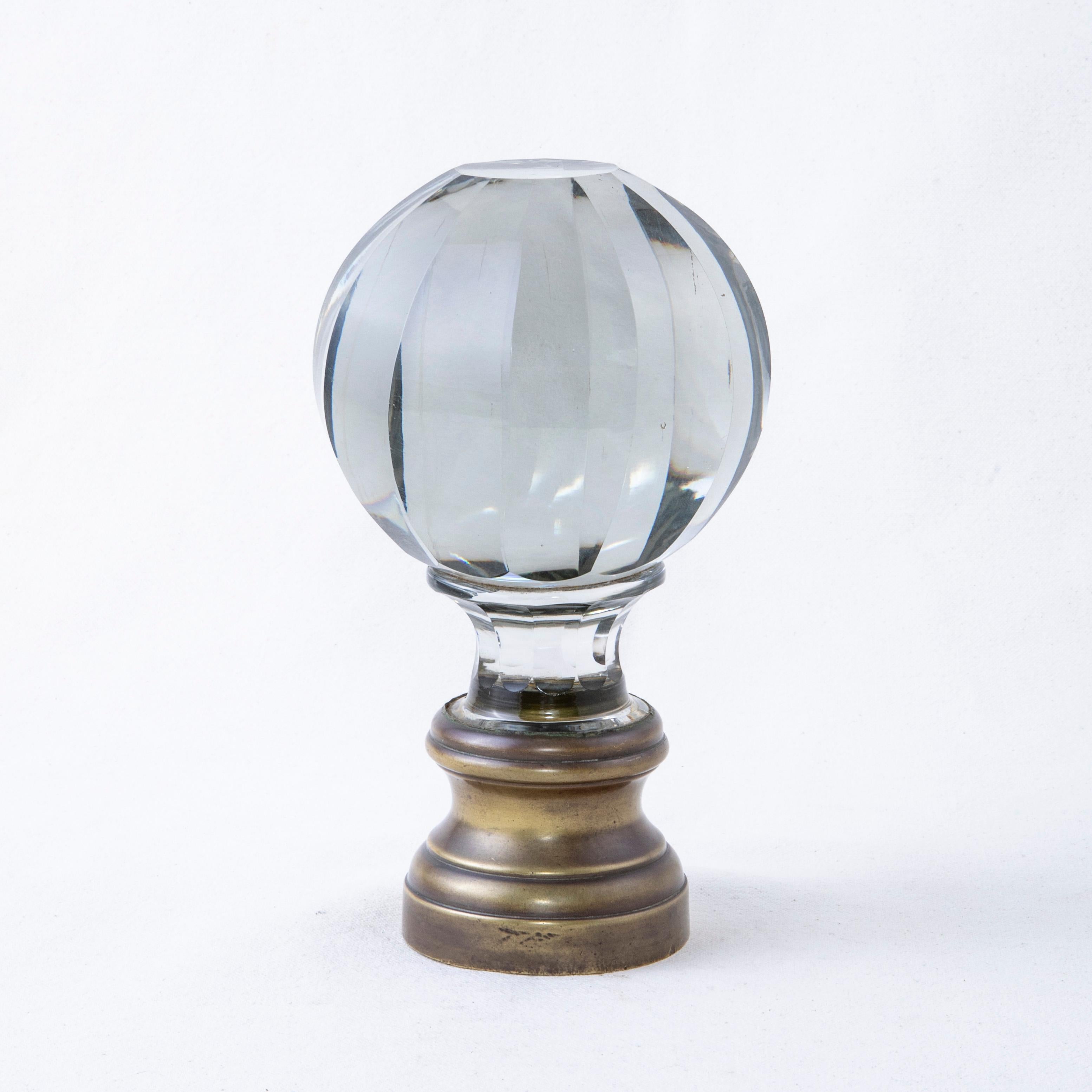 This very large late nineteenth century staircase finial was found in the city of Blois in the Loire Valley, the castle region of France. The finial features a multifaceted crystal ball mounted on a bronze base. The base may be secured onto a